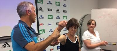Sports medicine doctor Stephen Kara trains GPs Annie Bradley and Margaret Goodey on MRI referrals
