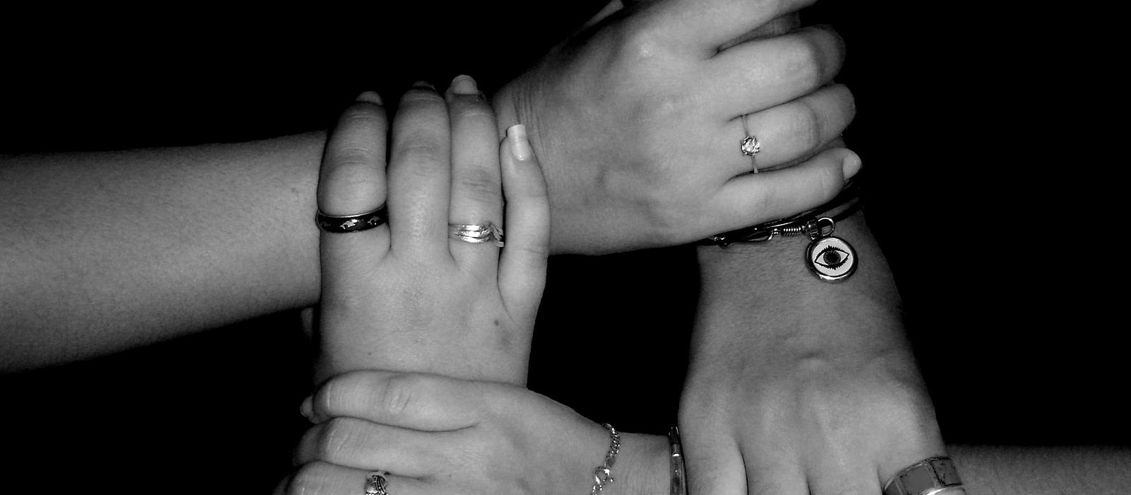 Support group, hands joined