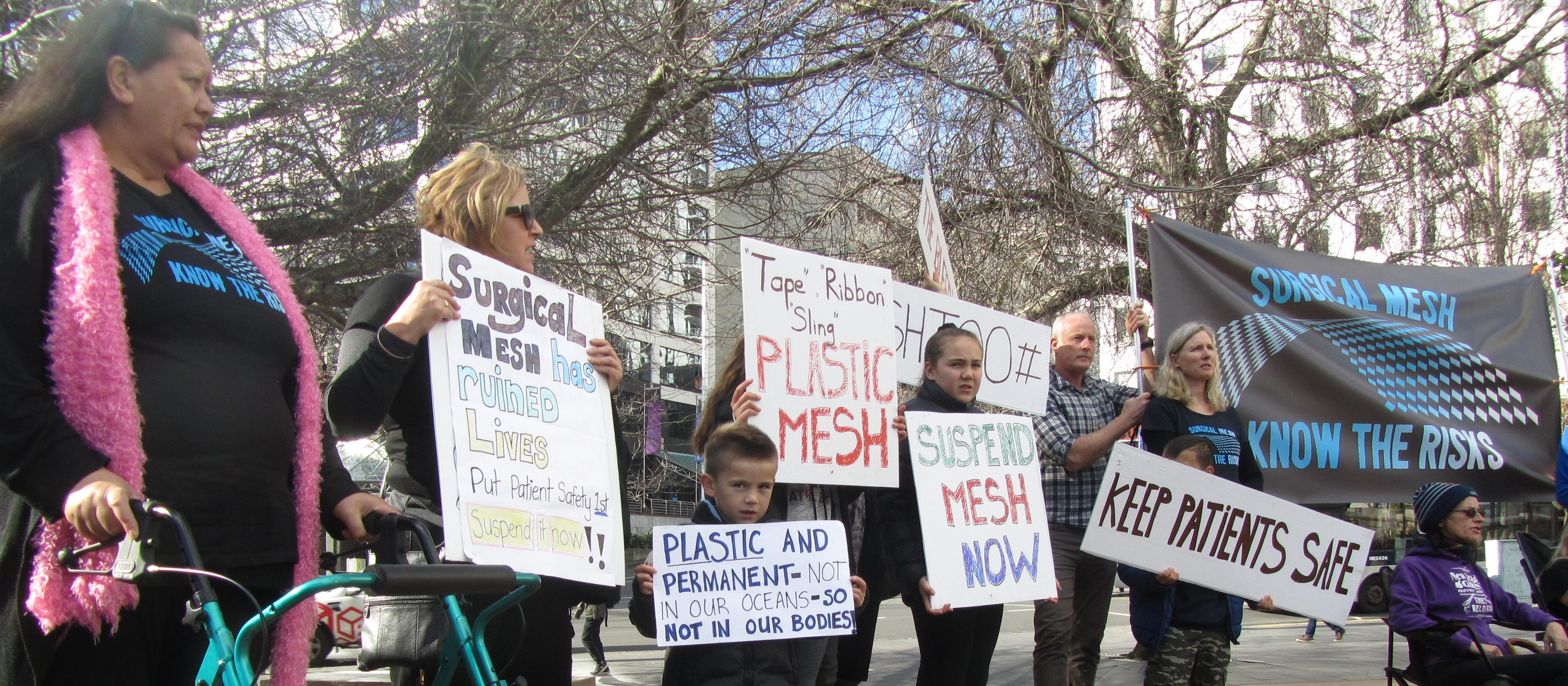 Protesters outside the RNZCGP conference 2018 call for use of surgical mesh to be suspended