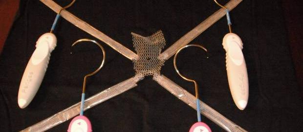 A sample of a pelvic organ prolapse mesh device and the surgical instruments used to implant them