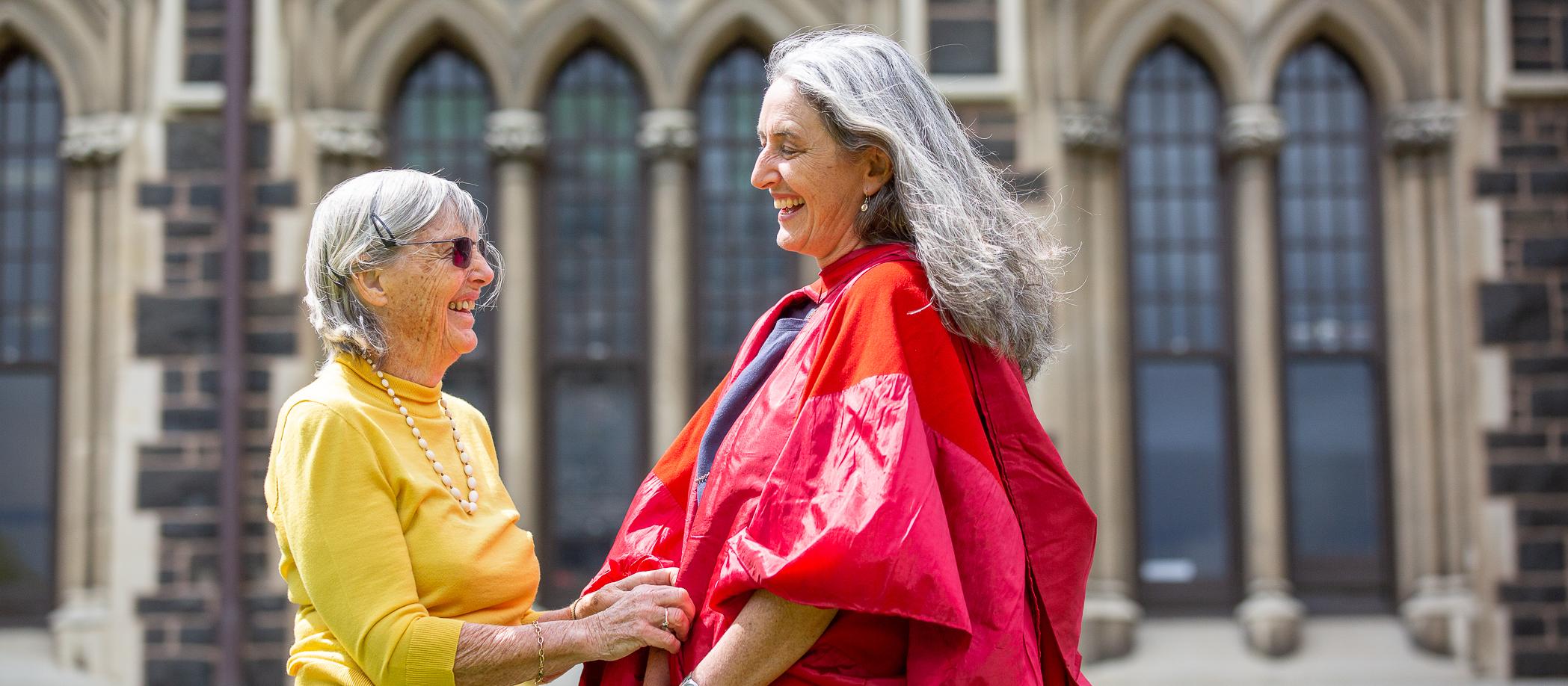 Edith Atmore (left) with daughter Dr Carol Atmore wearing great-grandmother's gown for PhD graduation 2019