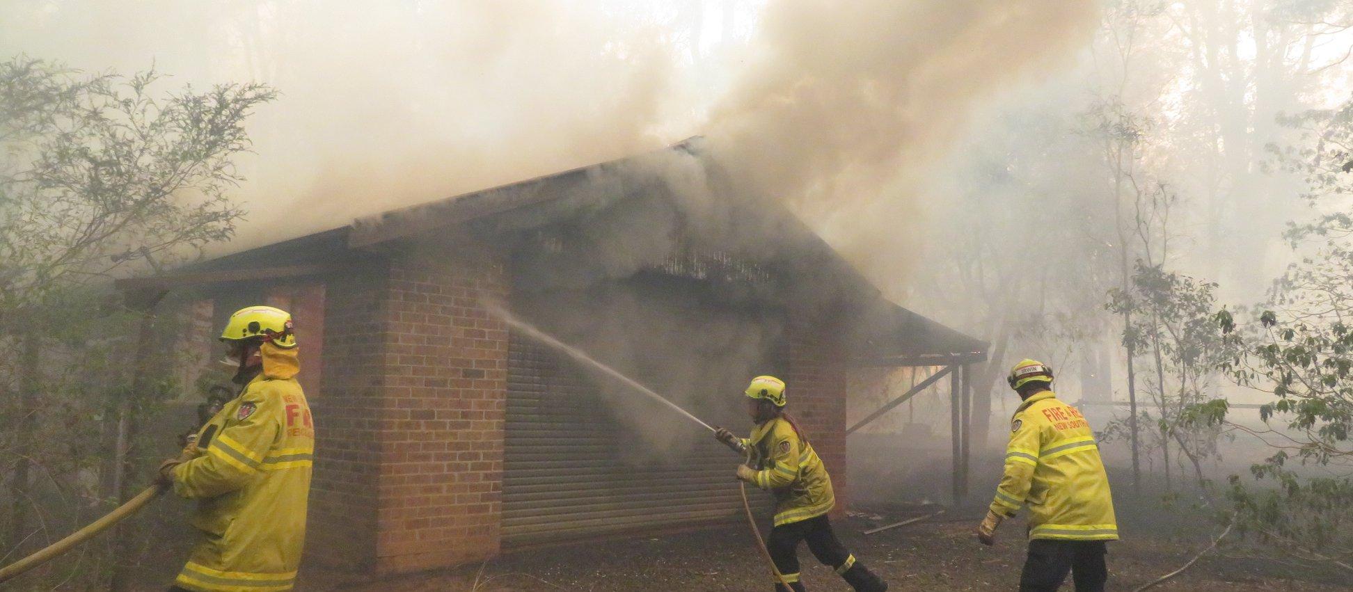 Fire fighters put out bushfire in NSW
