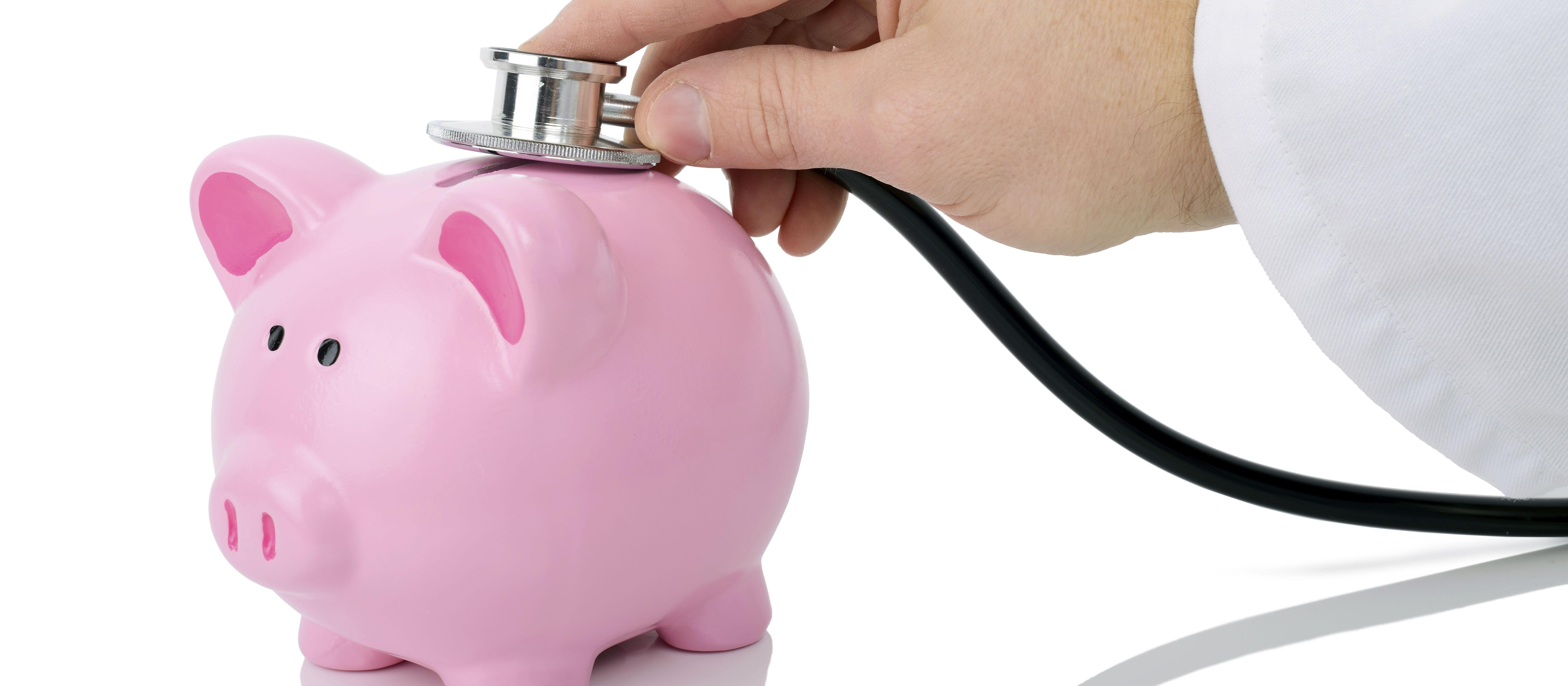 Piggy bank and stethoscope