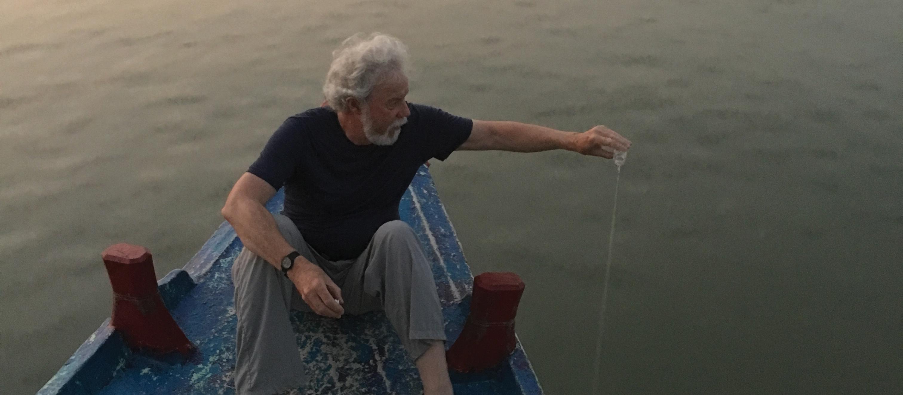 Marc Shaw pouring source water into the mouth of the Ganges