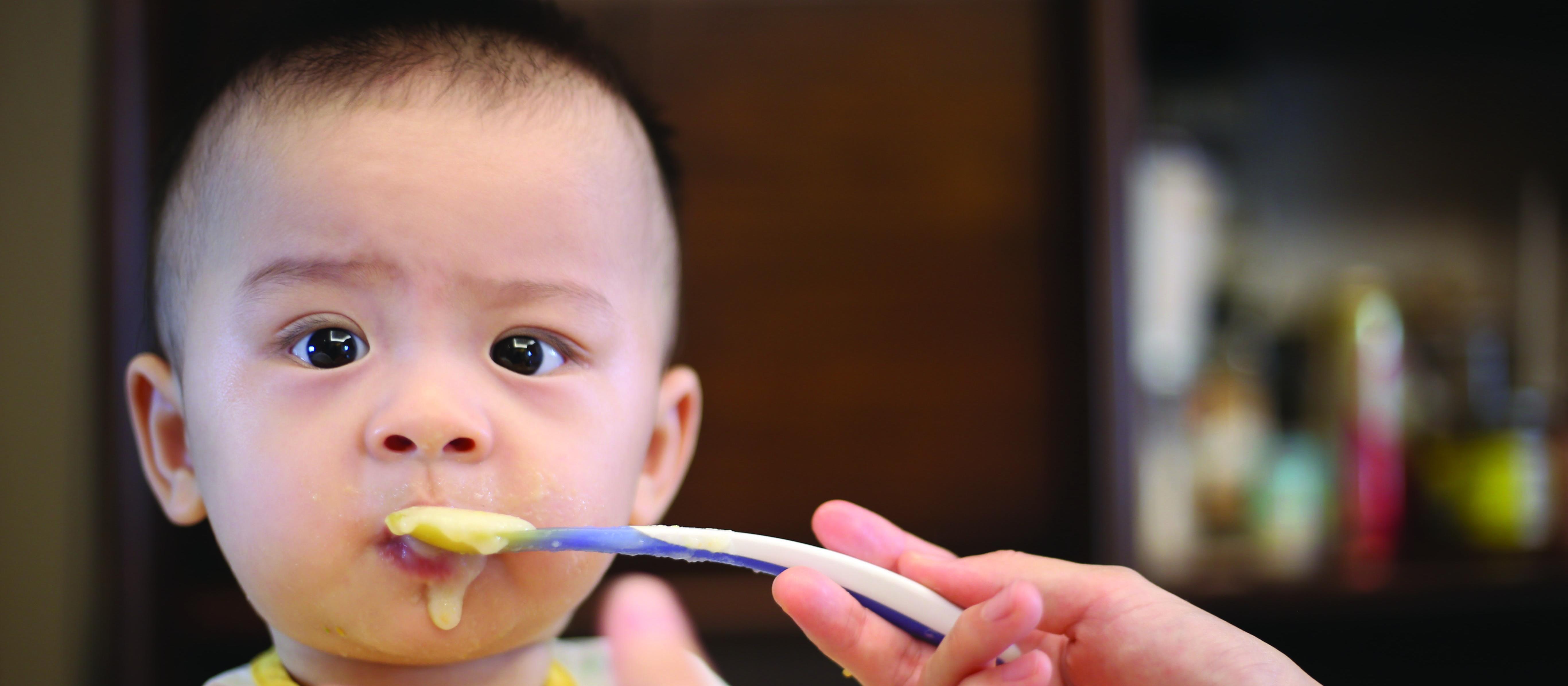 Baby being fed