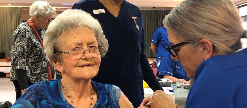 Evelyn Bennett is vaccinated by Tarankai DHB's Cheryl Jackson