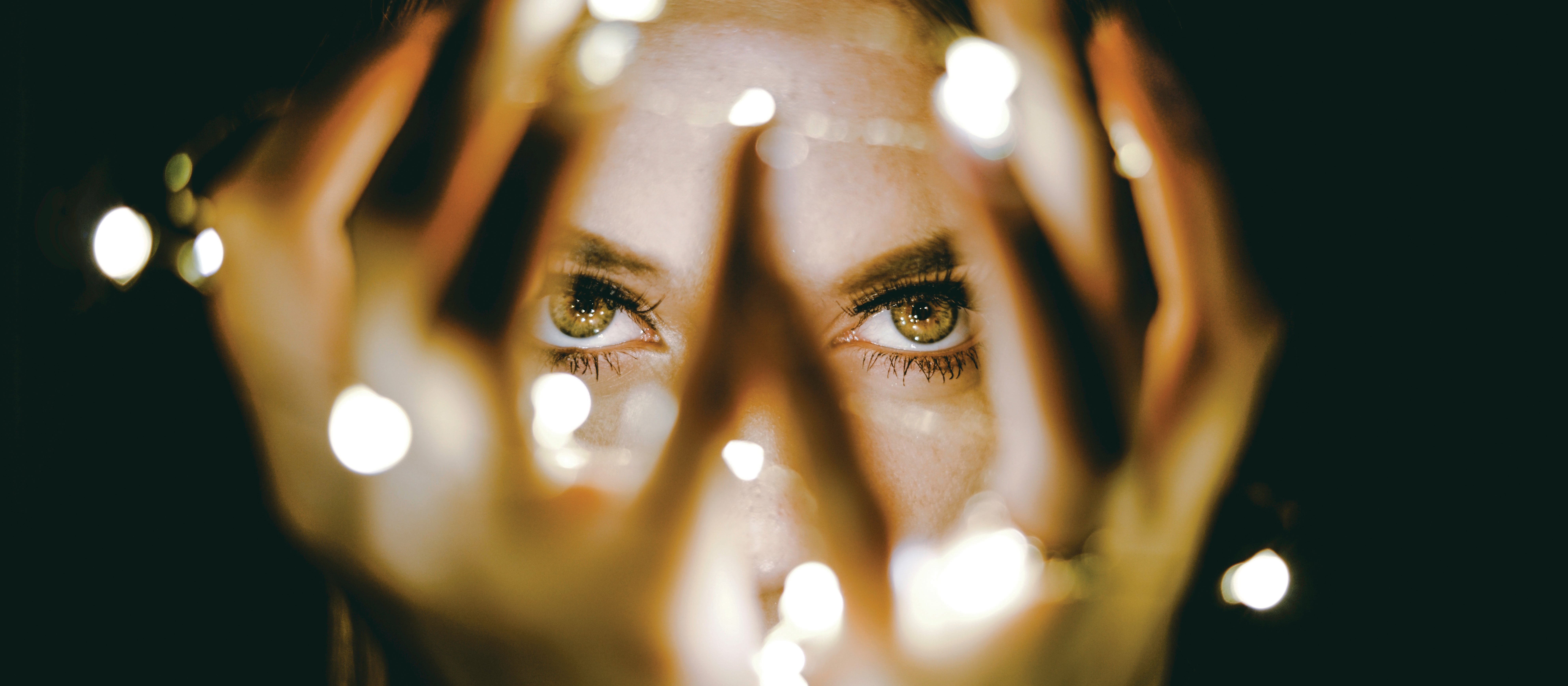 Lady holding lights_Rhett Wesley on Unsplash
