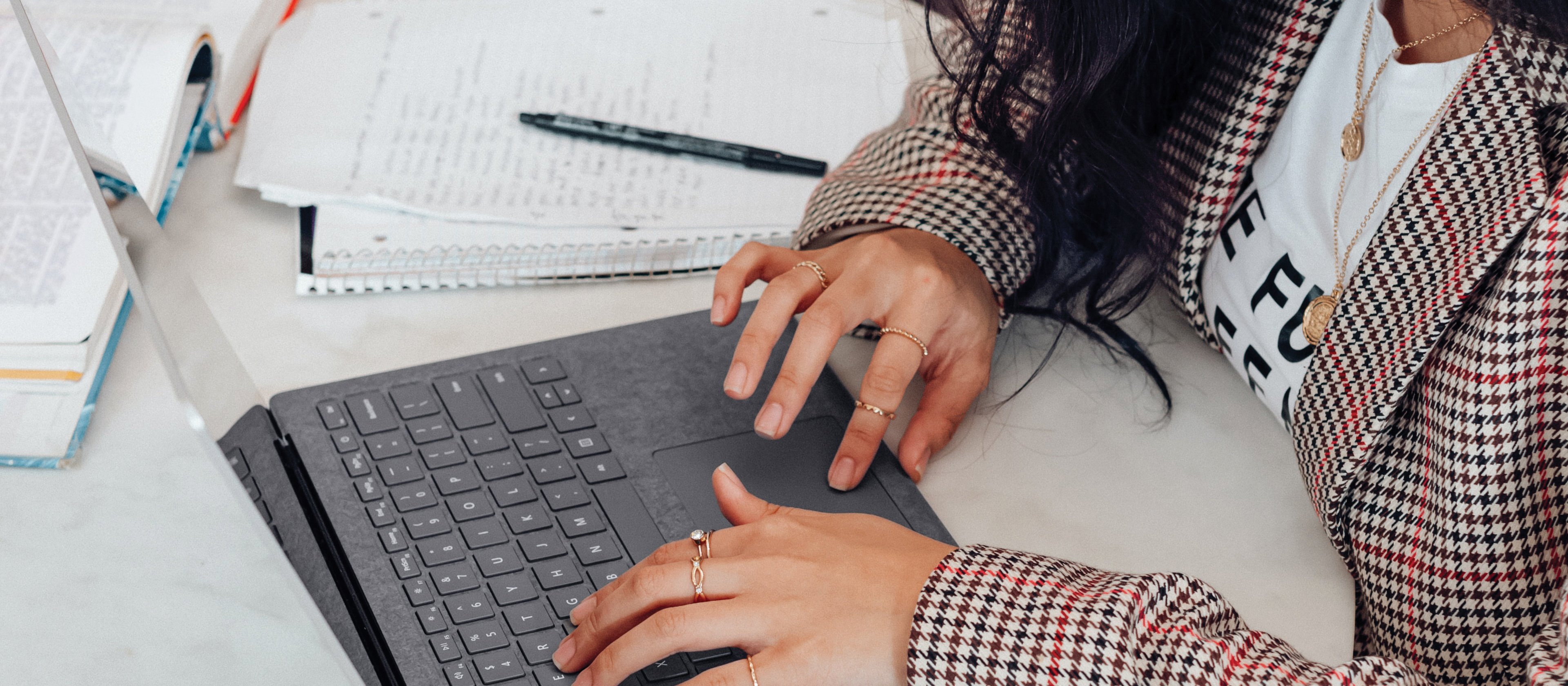 Young woman on laptop_Surface on Unsplash