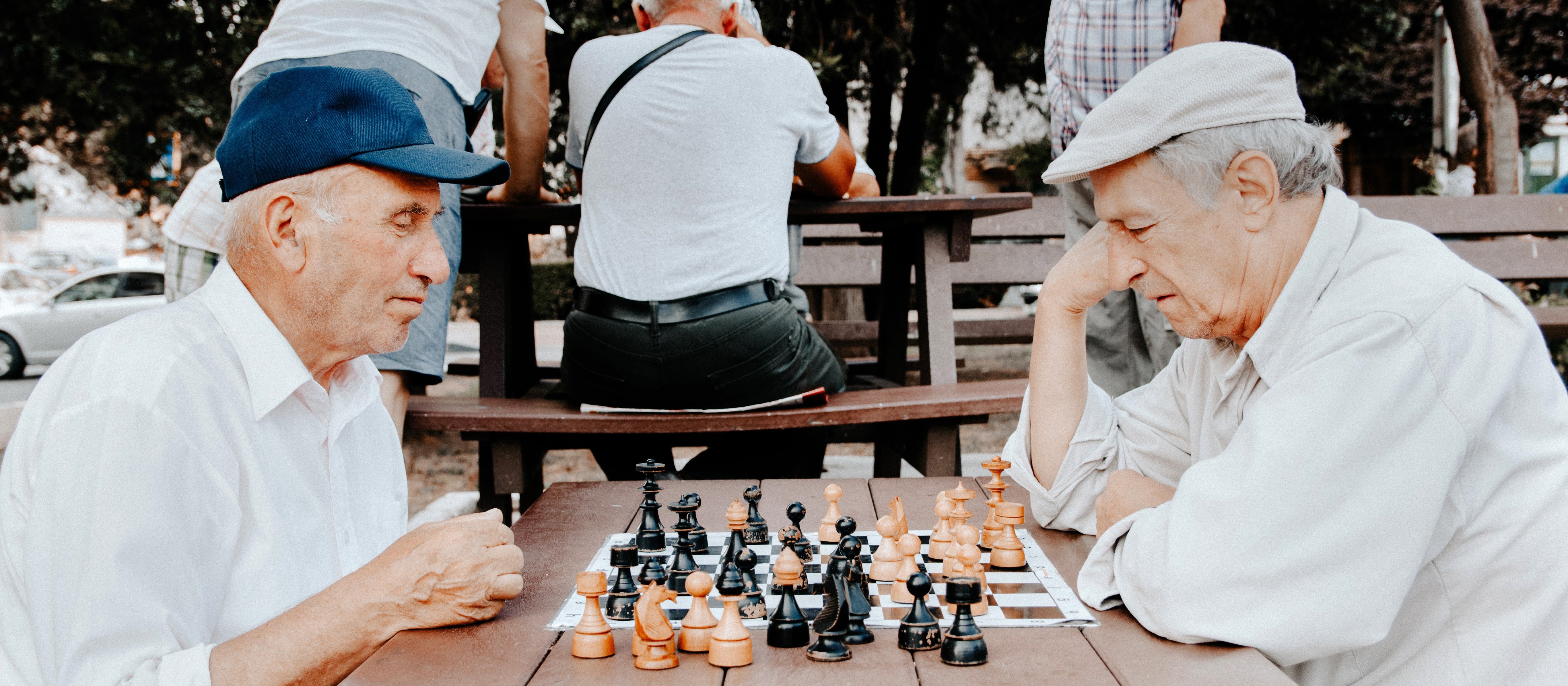 Elderly men playing chess
