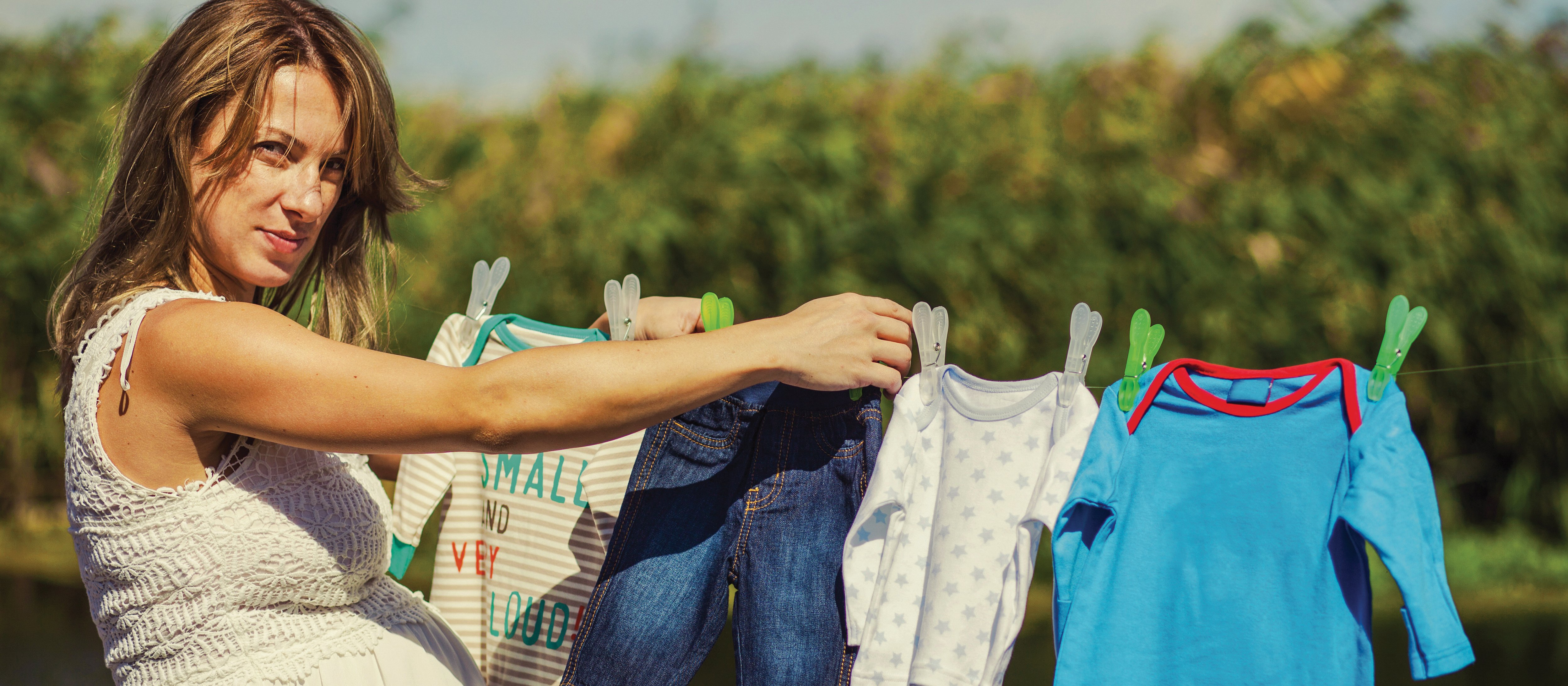  iStock pregnant woman hangs washing