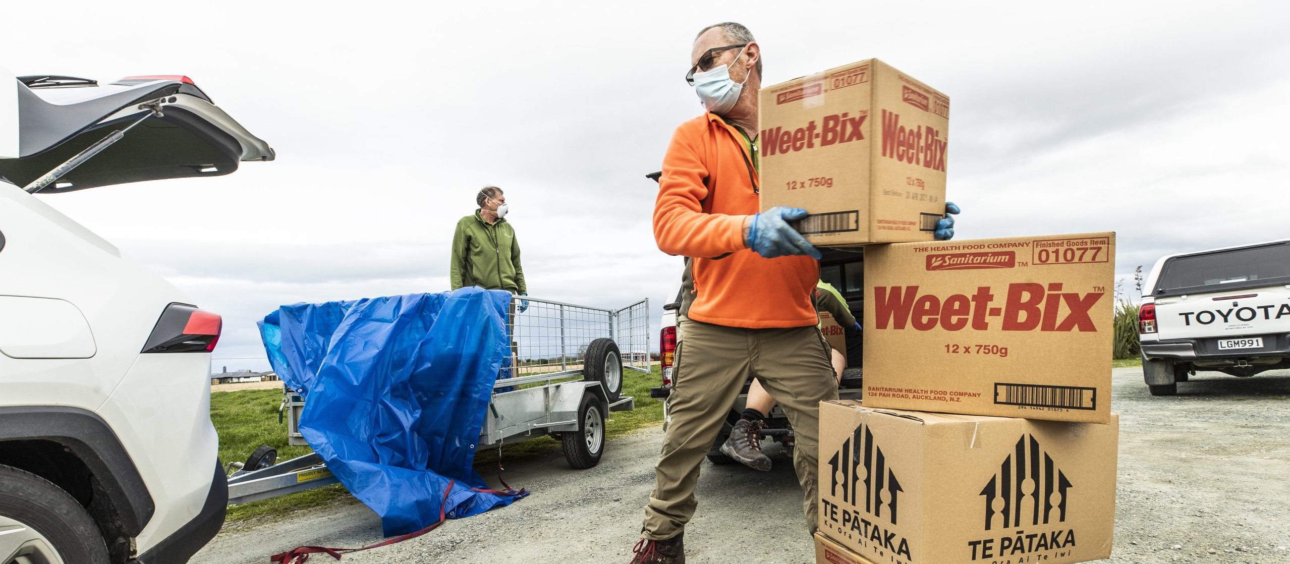 Biodiversity rangers Darren Foxwell, left, and Gus Johnston help distribute Te Pātaka food parcels at Te Awhina Marae in Motueka, and other locations around the top of the south during level 4 lockdown in August last year