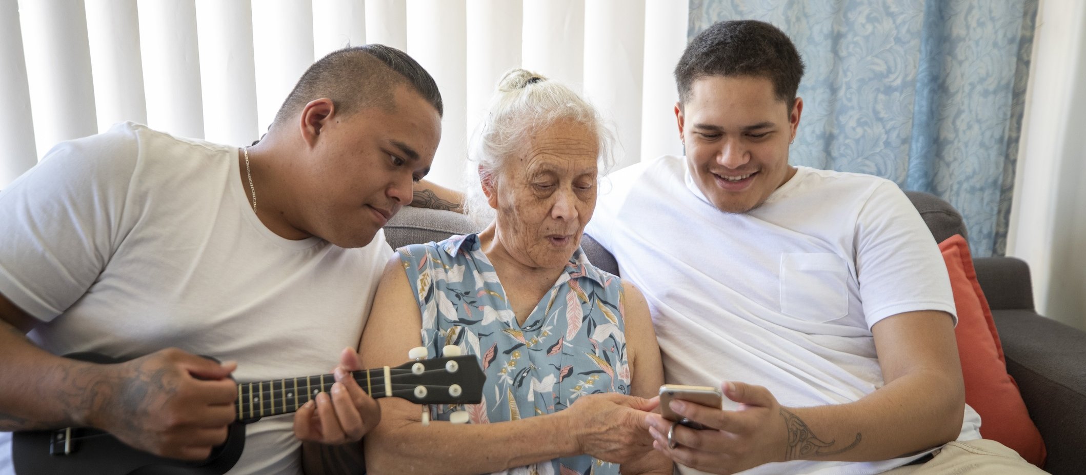 Elderly woman with whanau [Image: iStock]