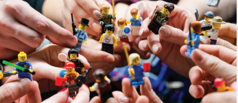 Hands holding lego