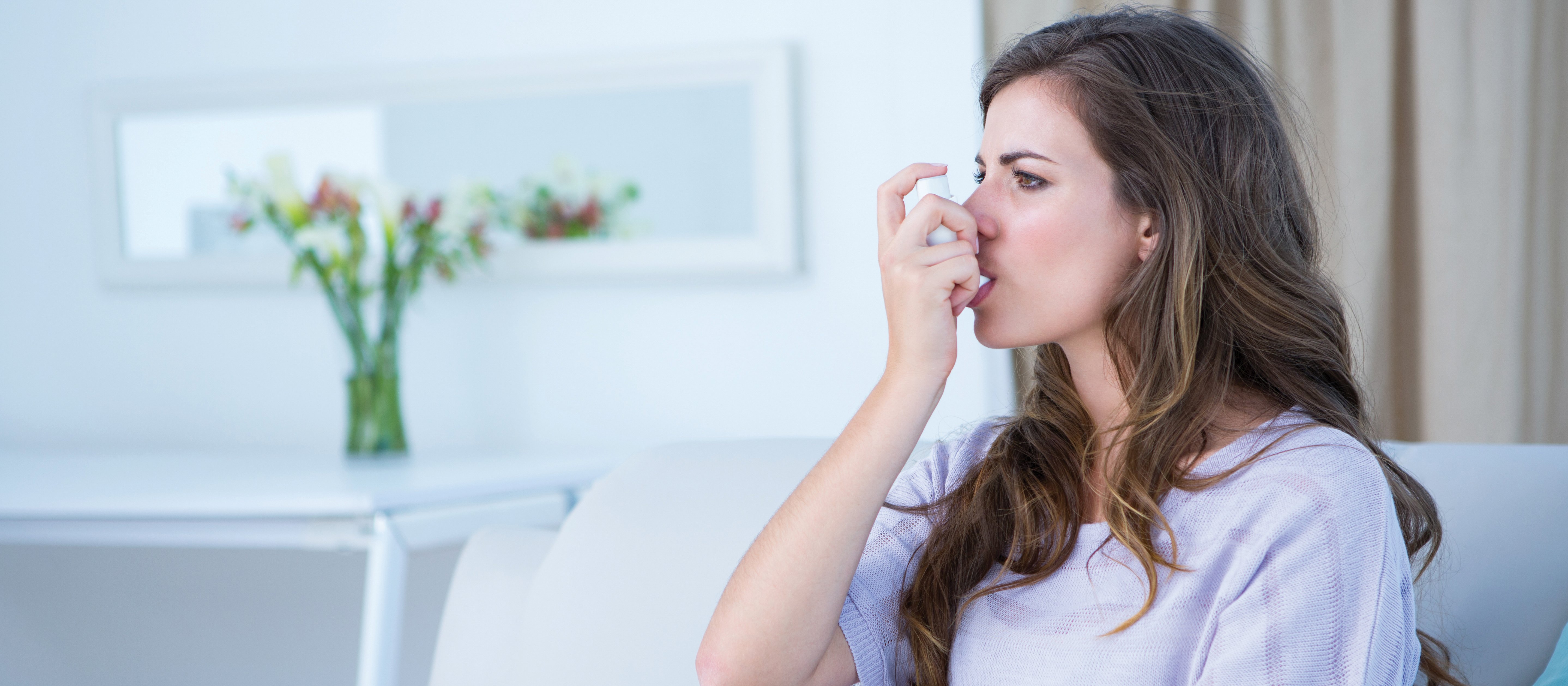 asthma inhaler in use Wavebreakmedia FreeImages