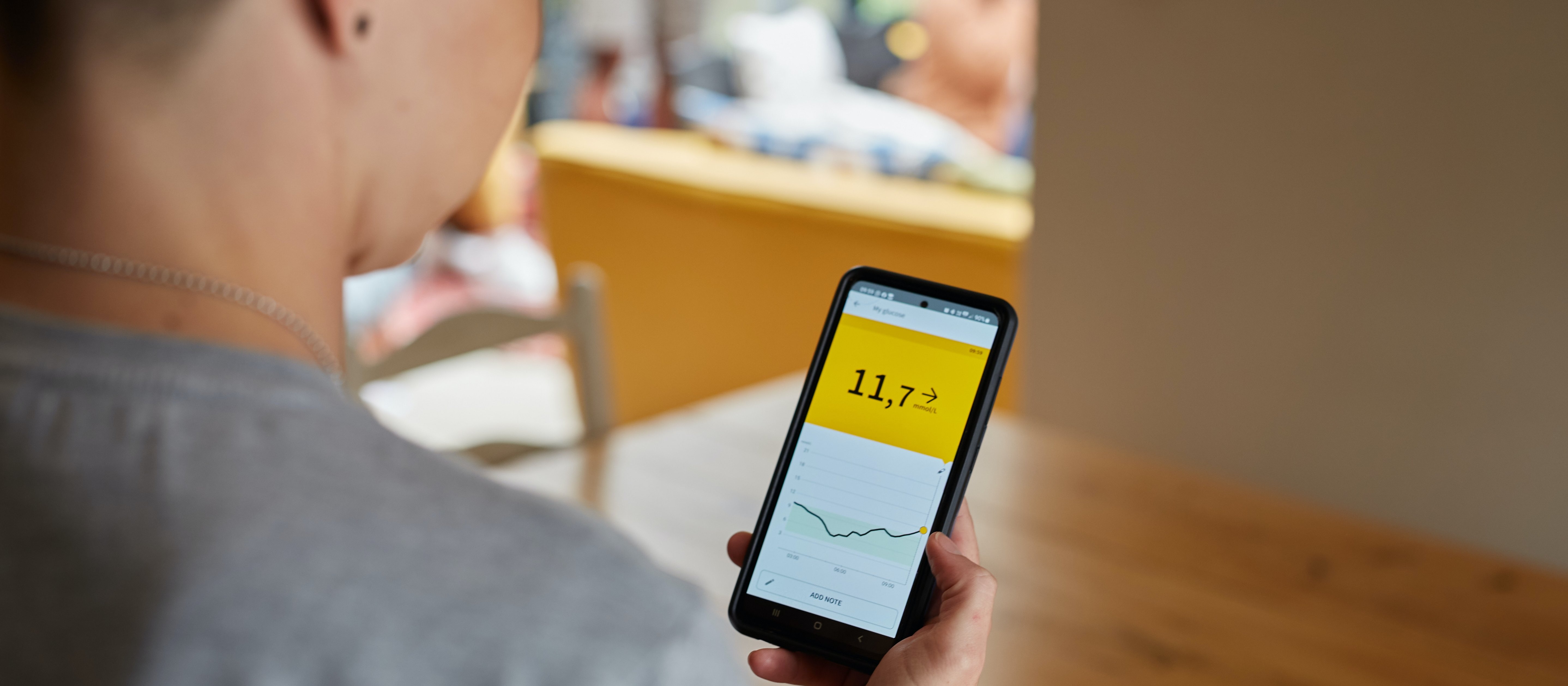person using continuous glucose monitor