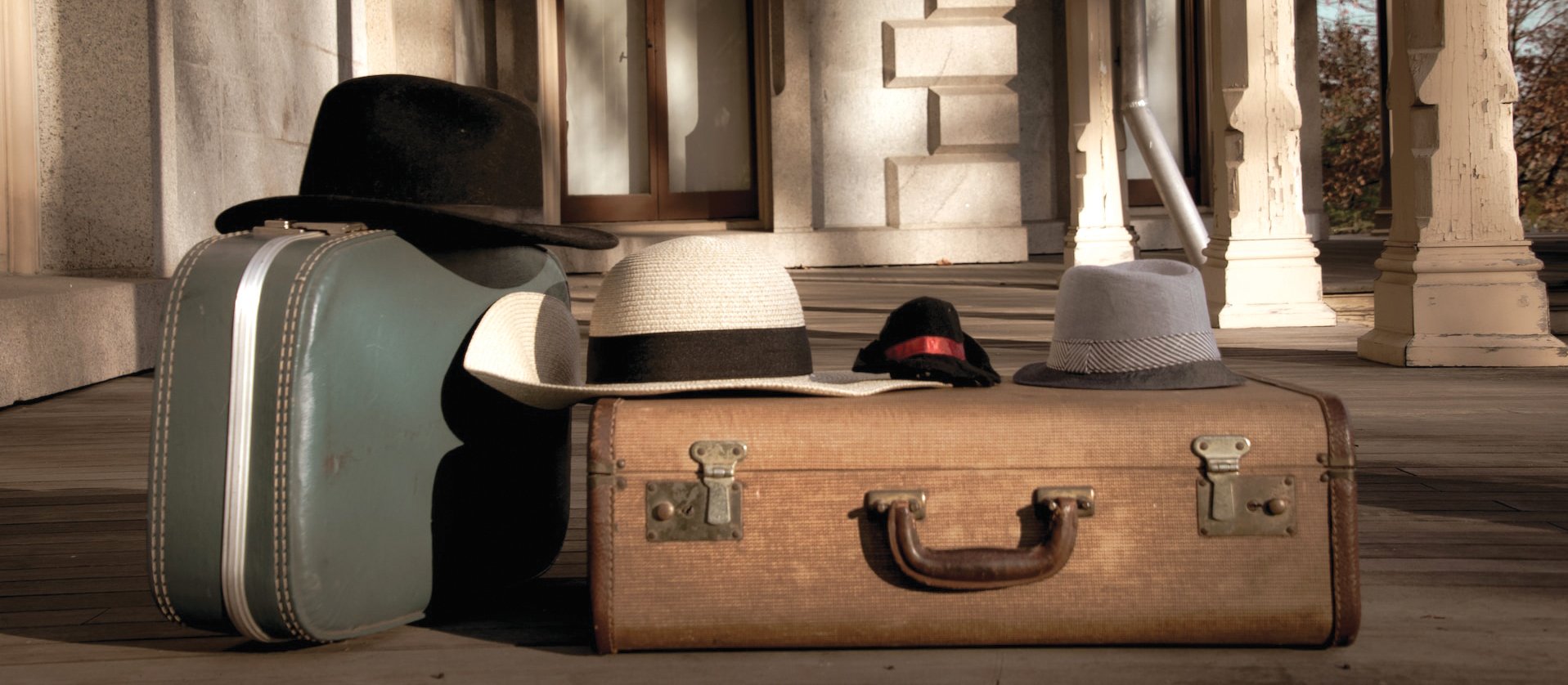 Suitcase old Fedora hats CR Christopher Luther on Unsplash