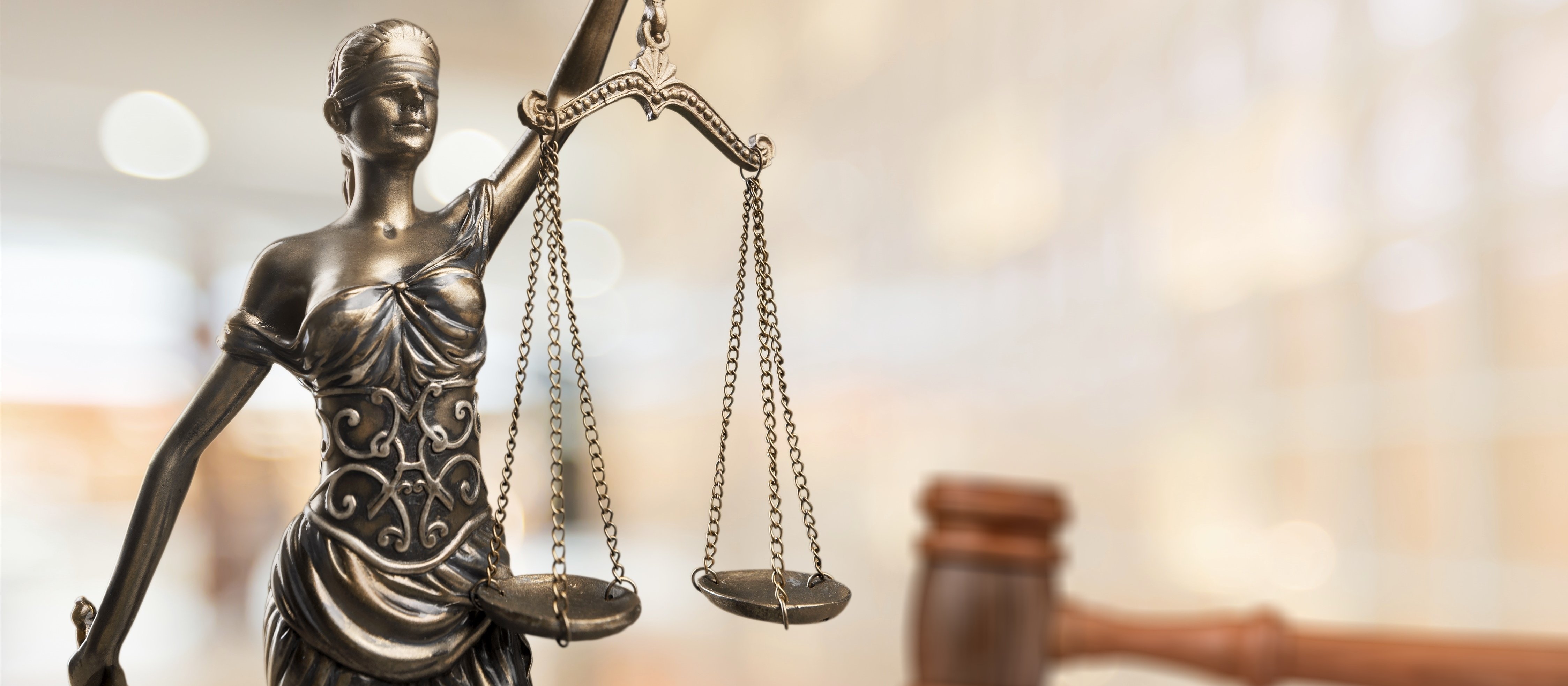 Female statuette holding up scales