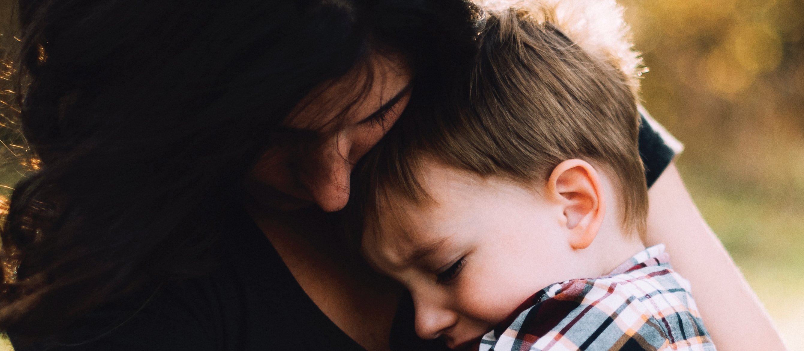 Woman hugs child CR Jordan Whitt on Unsplash