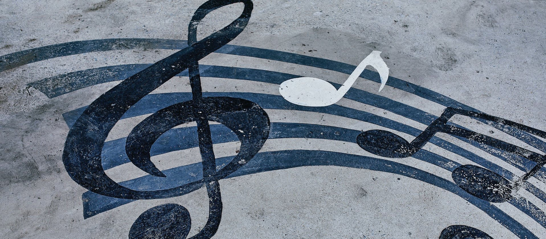 Music notes on sand CR Tengyart on Unsplash