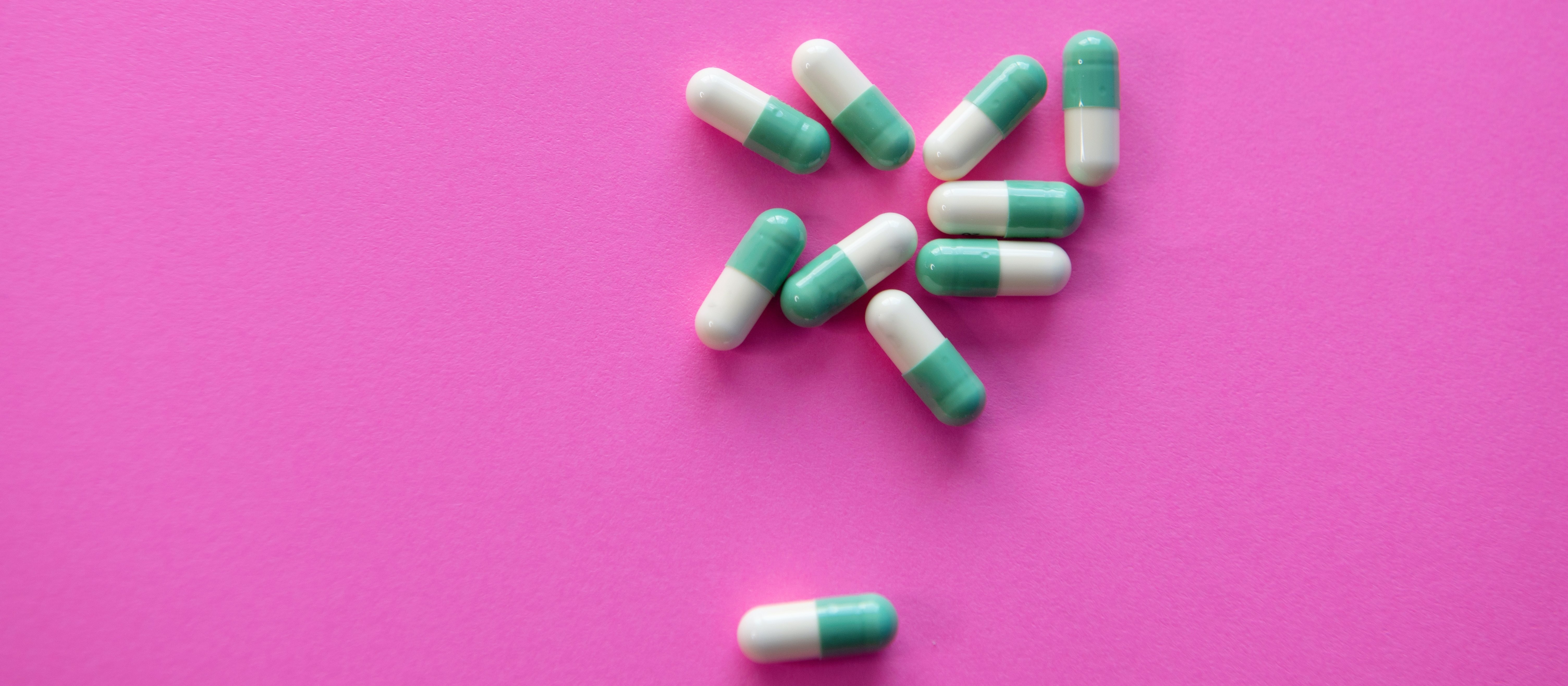 Pills on a pink background