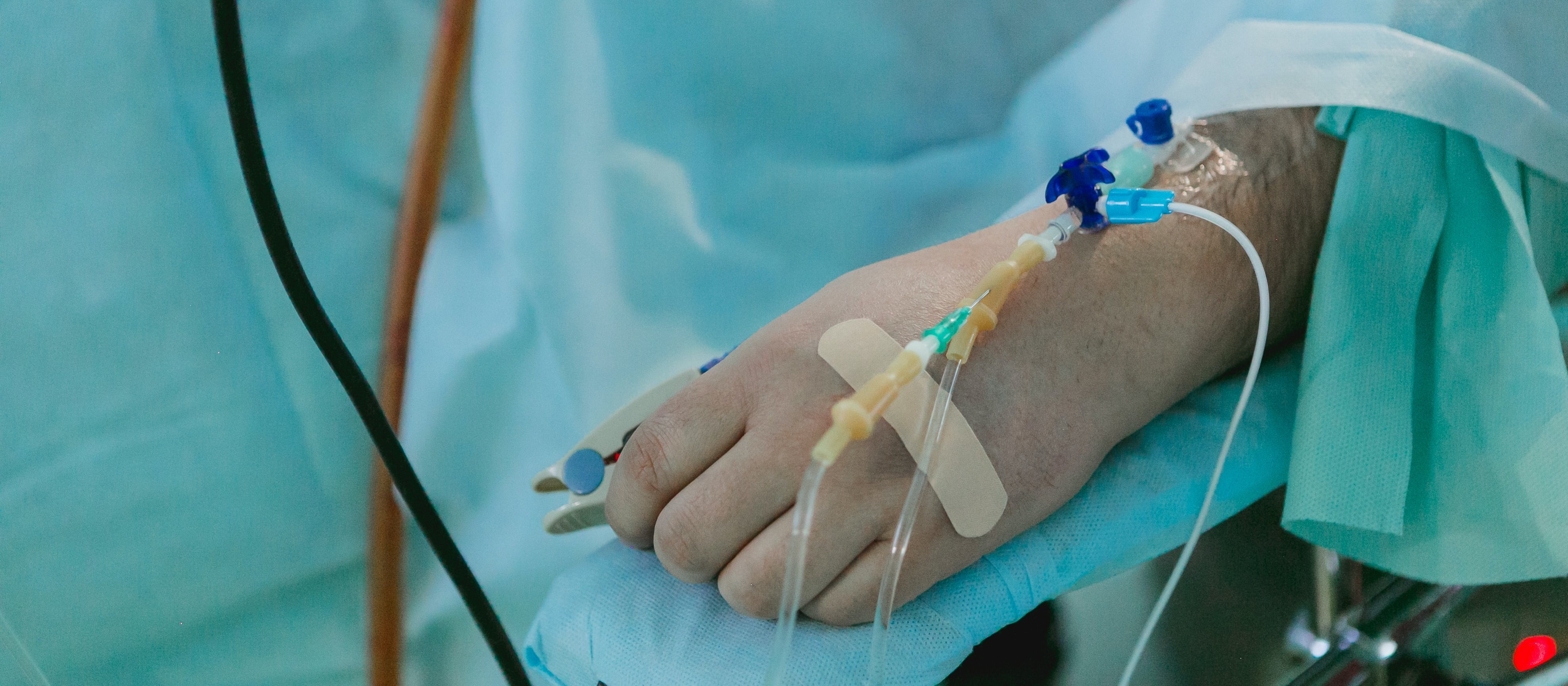 Patient in hospital bed with IV