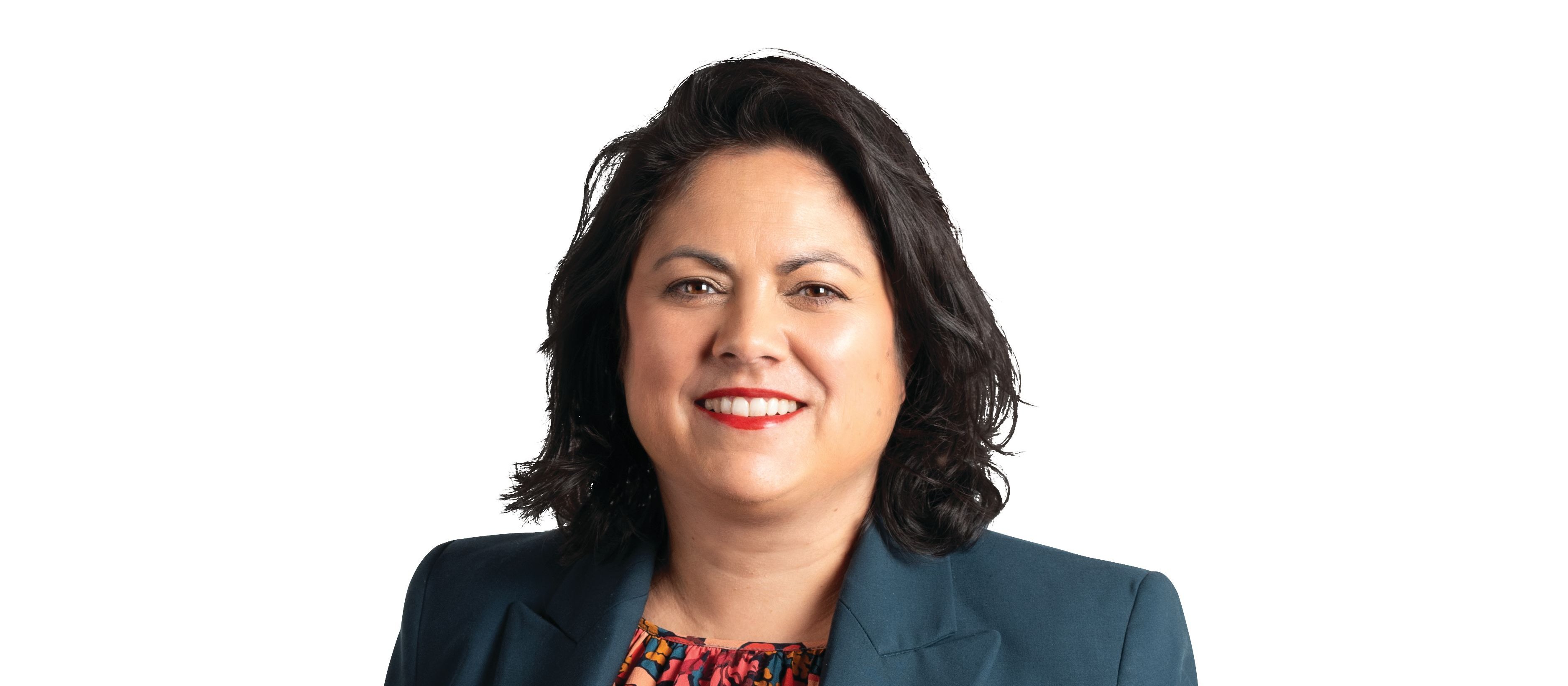 Ayesha Verrall, dressed in navy blue suit and floral top
