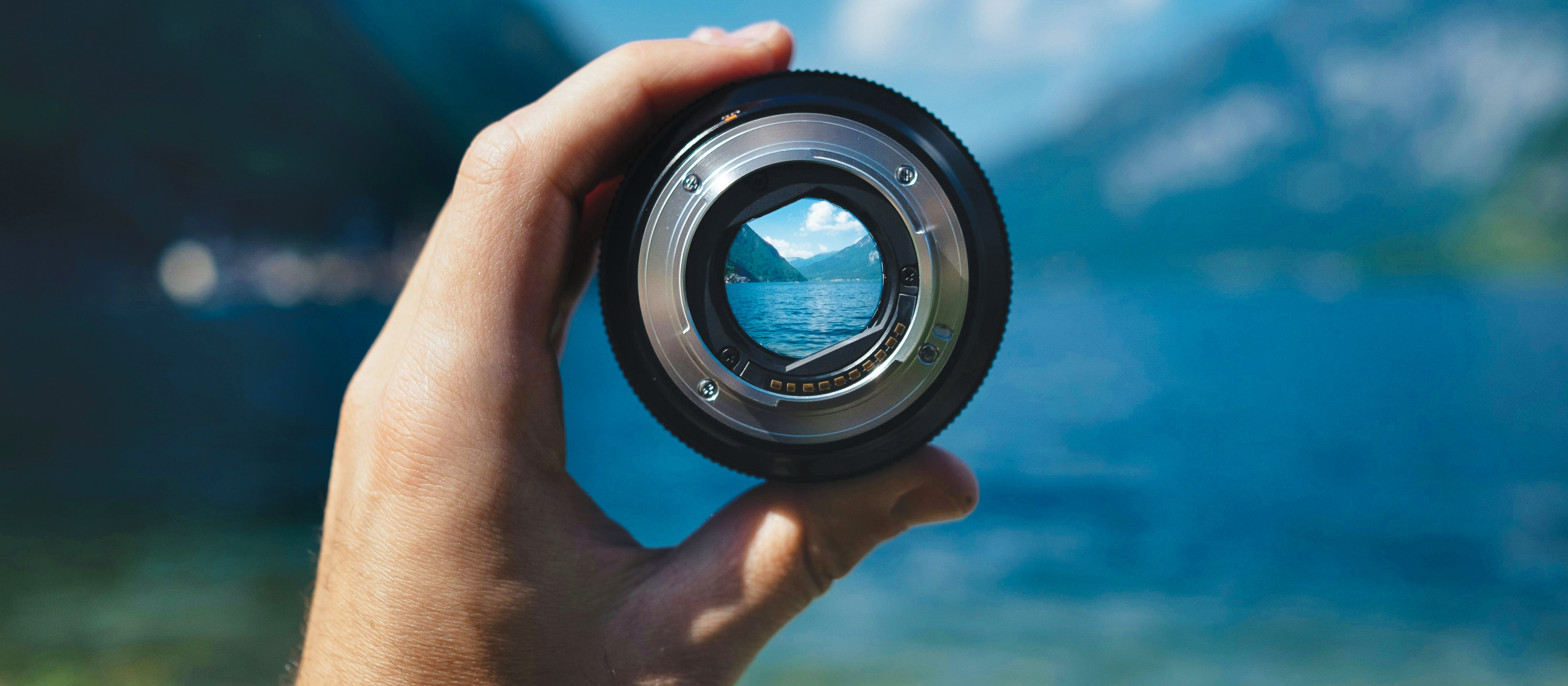 Camera lens Held up CR Paul Skorupskas on Unsplash