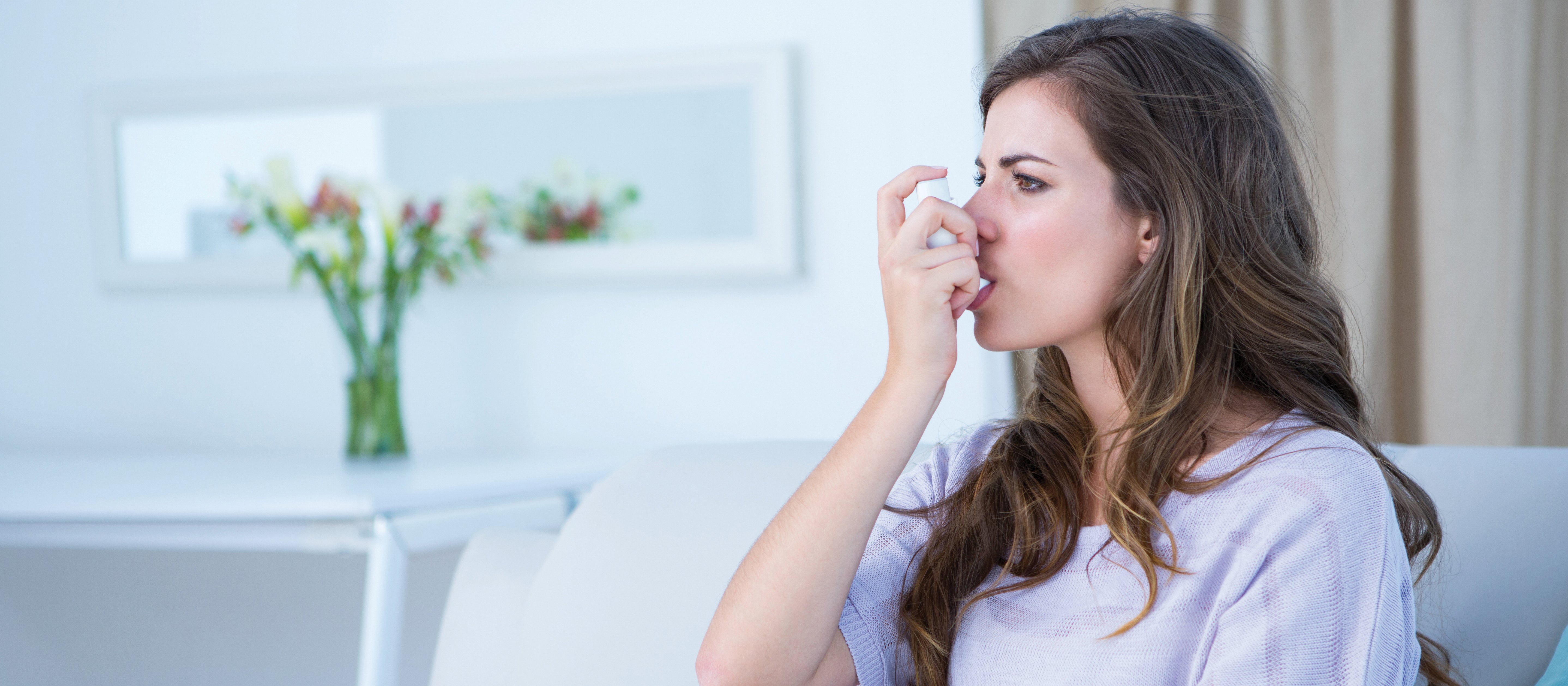 asthma inhaler in use Wavebreakmedia FreeImages
