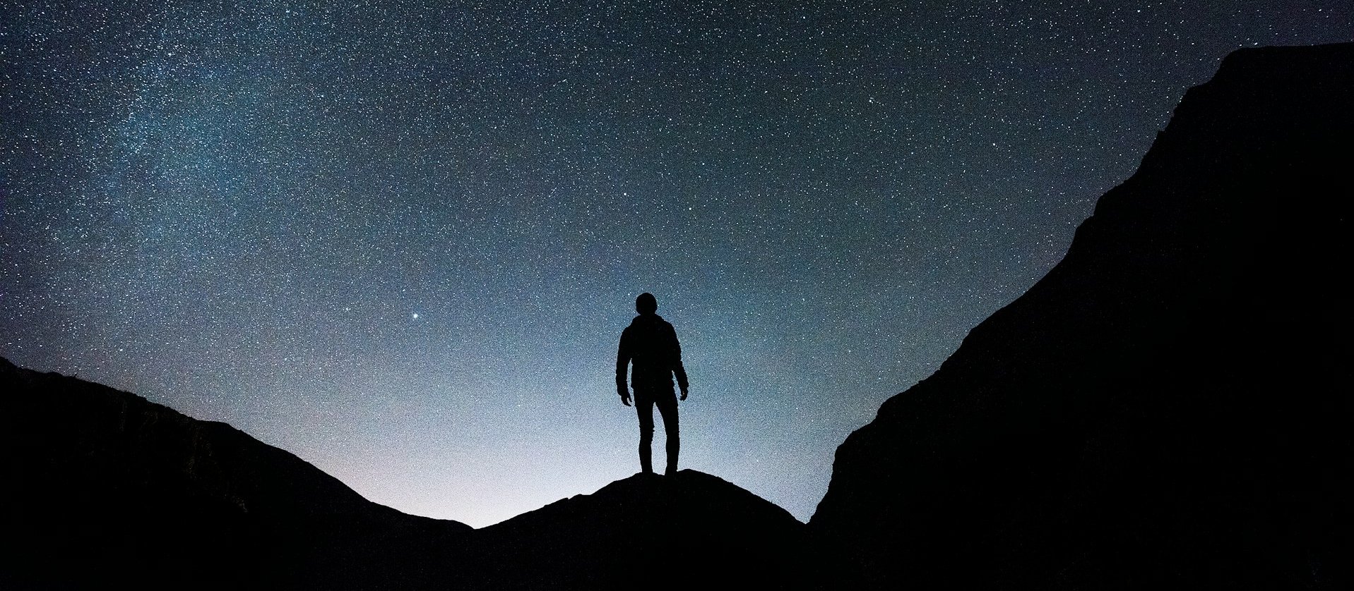 Starry night and man CR Joshua Earle on Unsplash