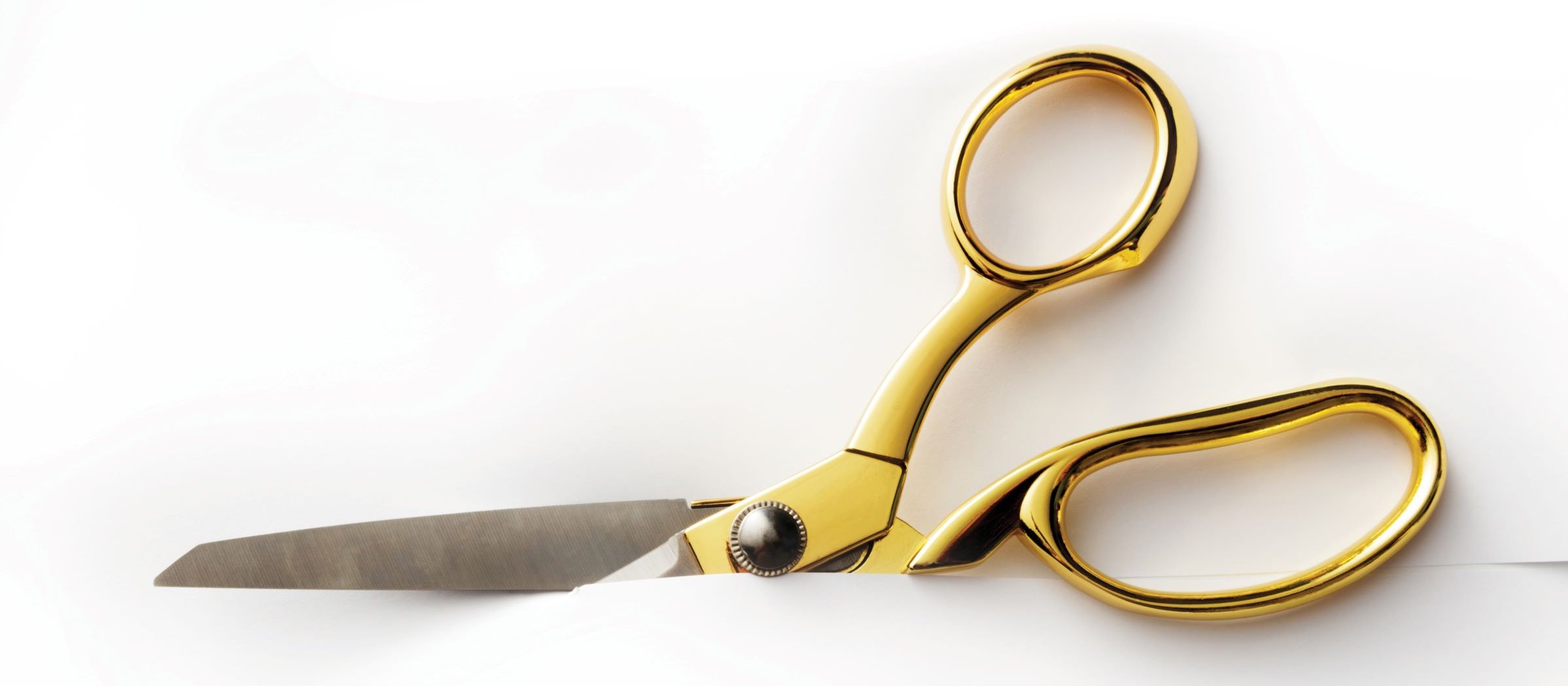 Golden Scissors Cutting CR Floortje on iStock