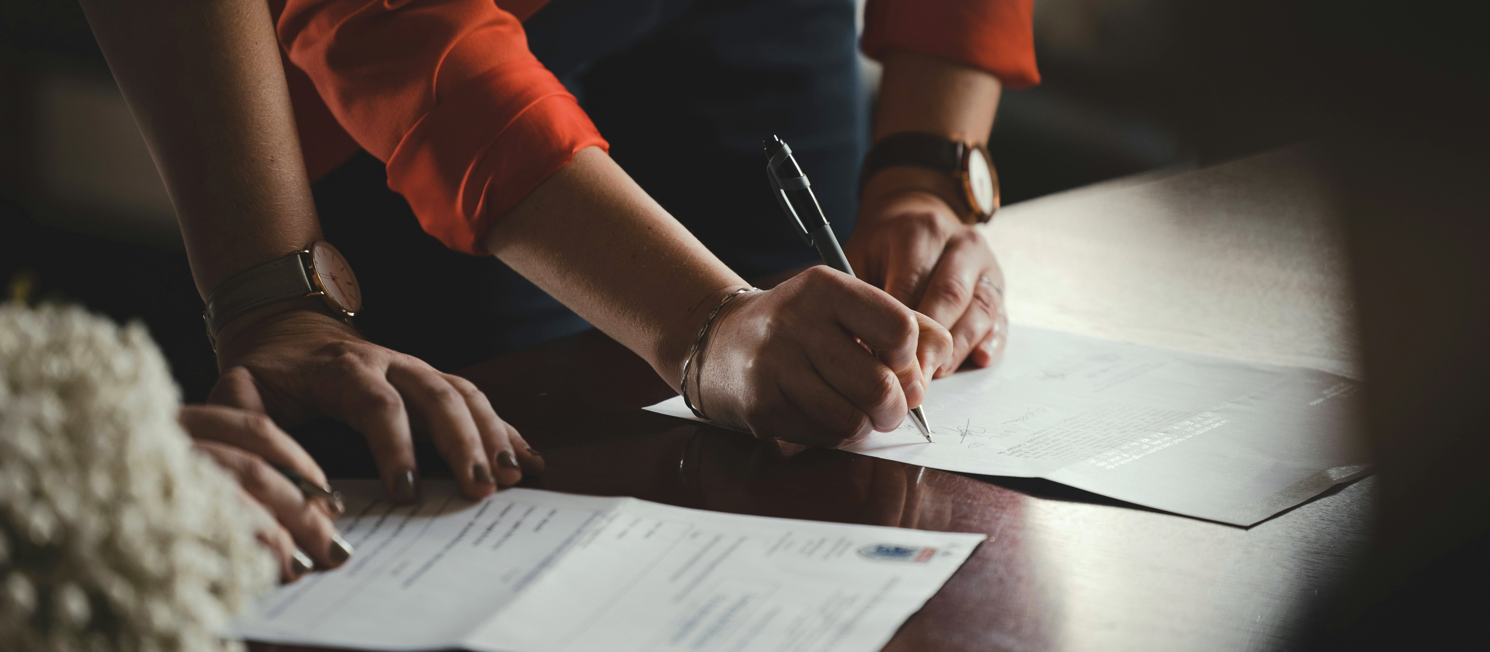 Signing papers CR Romain Dancre on Unsplash