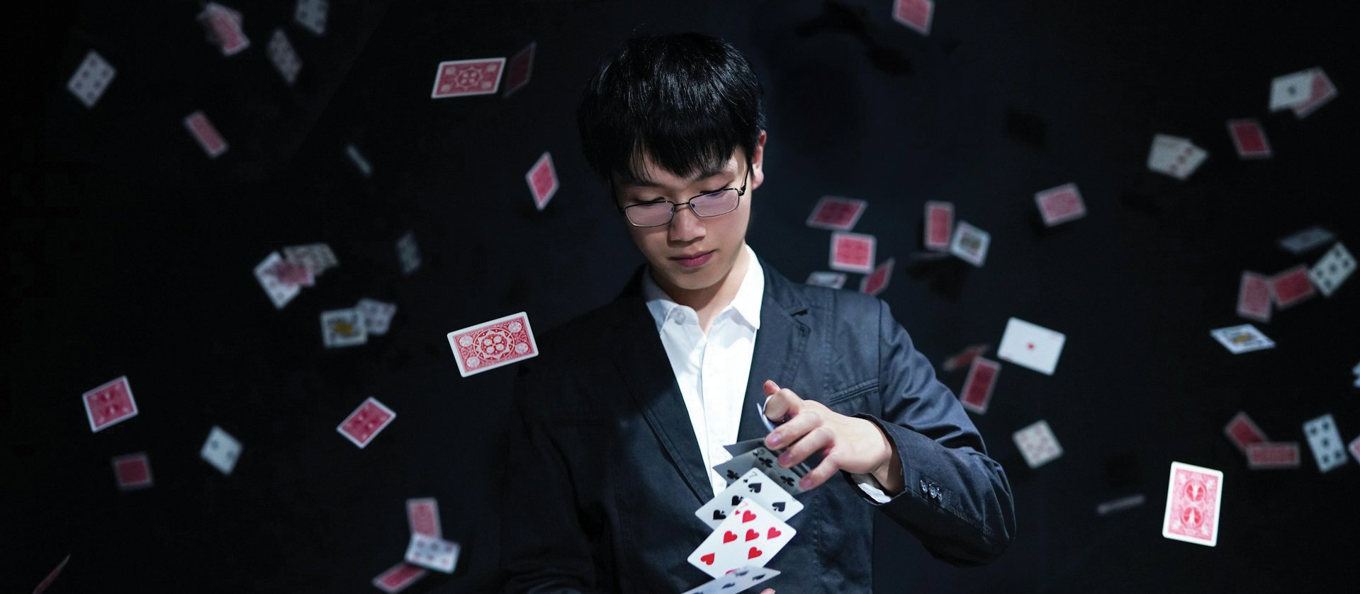 Man with cards CR Fengyou Wan on Unsplash 