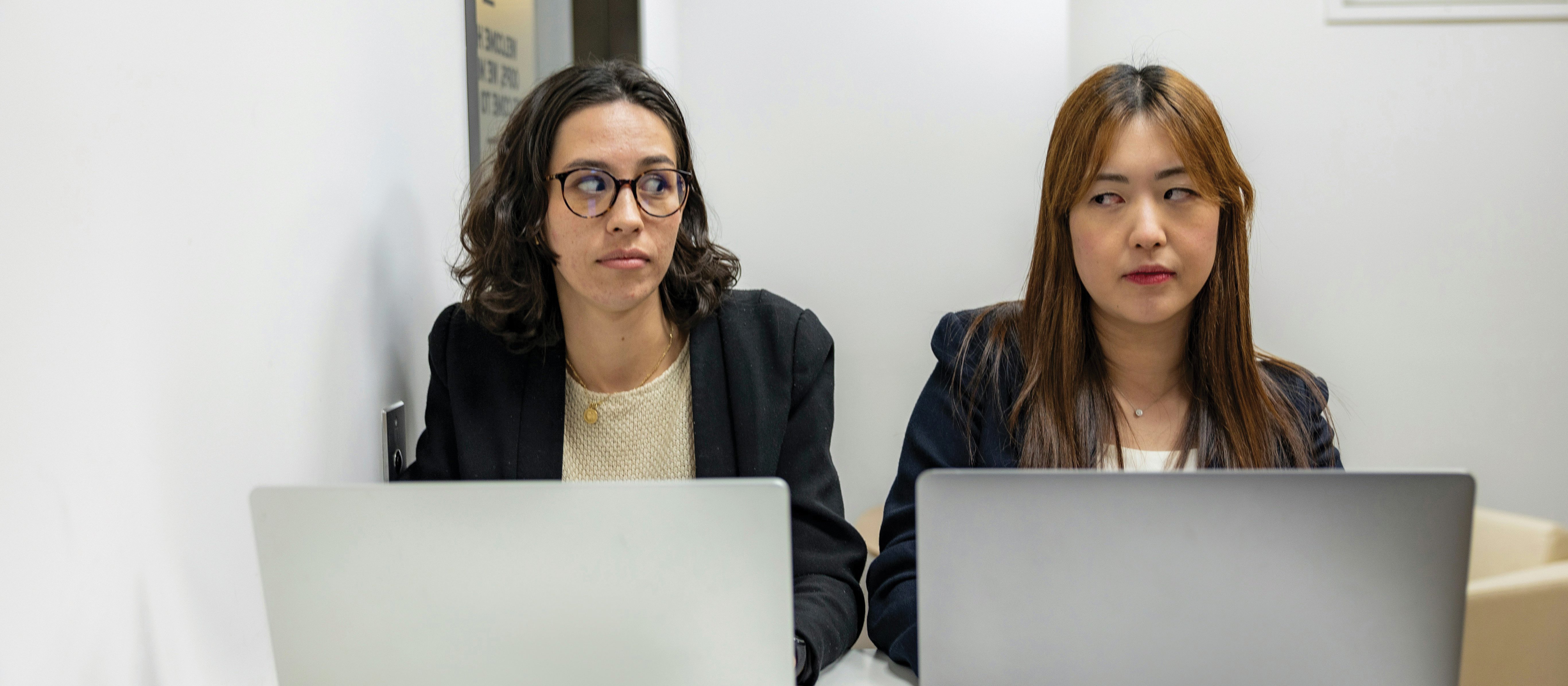 Two women desk CR resume genius on Unsplash