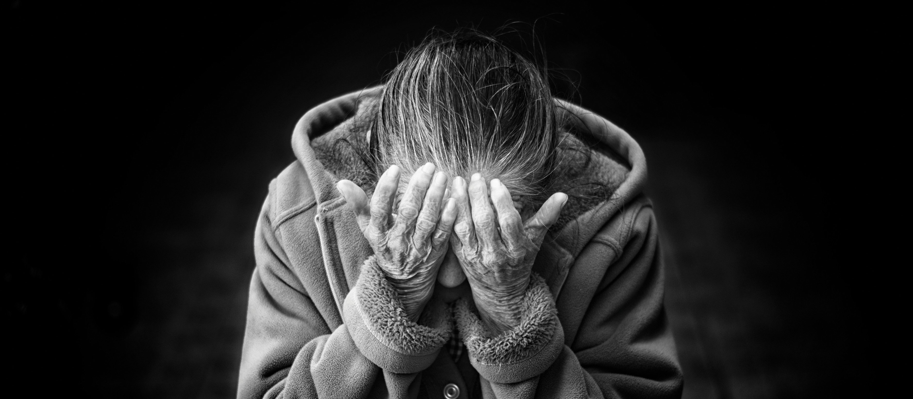 Elderly-woman-face-in-hands