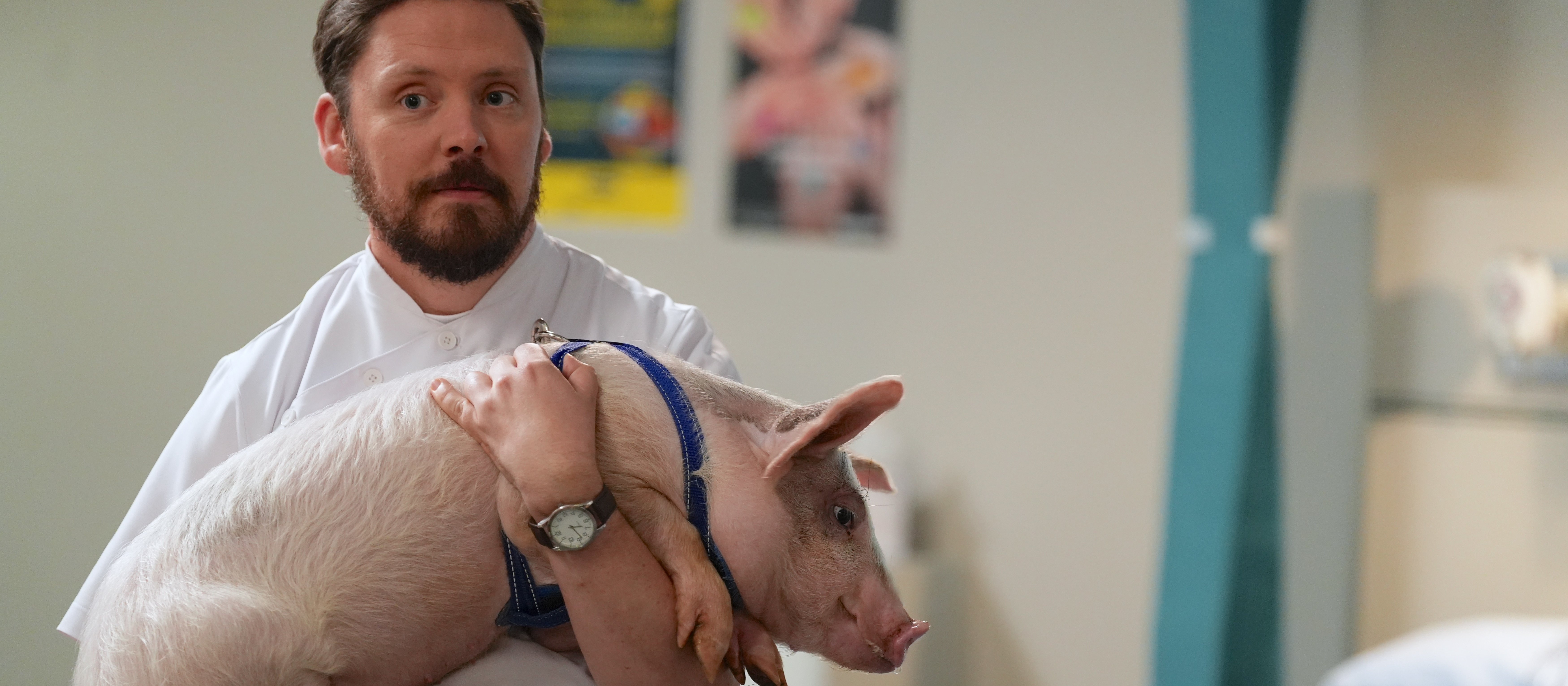 Thaddeus Fleiss (Paul Waggott) holding Alexander the pig [Image: Supplied]