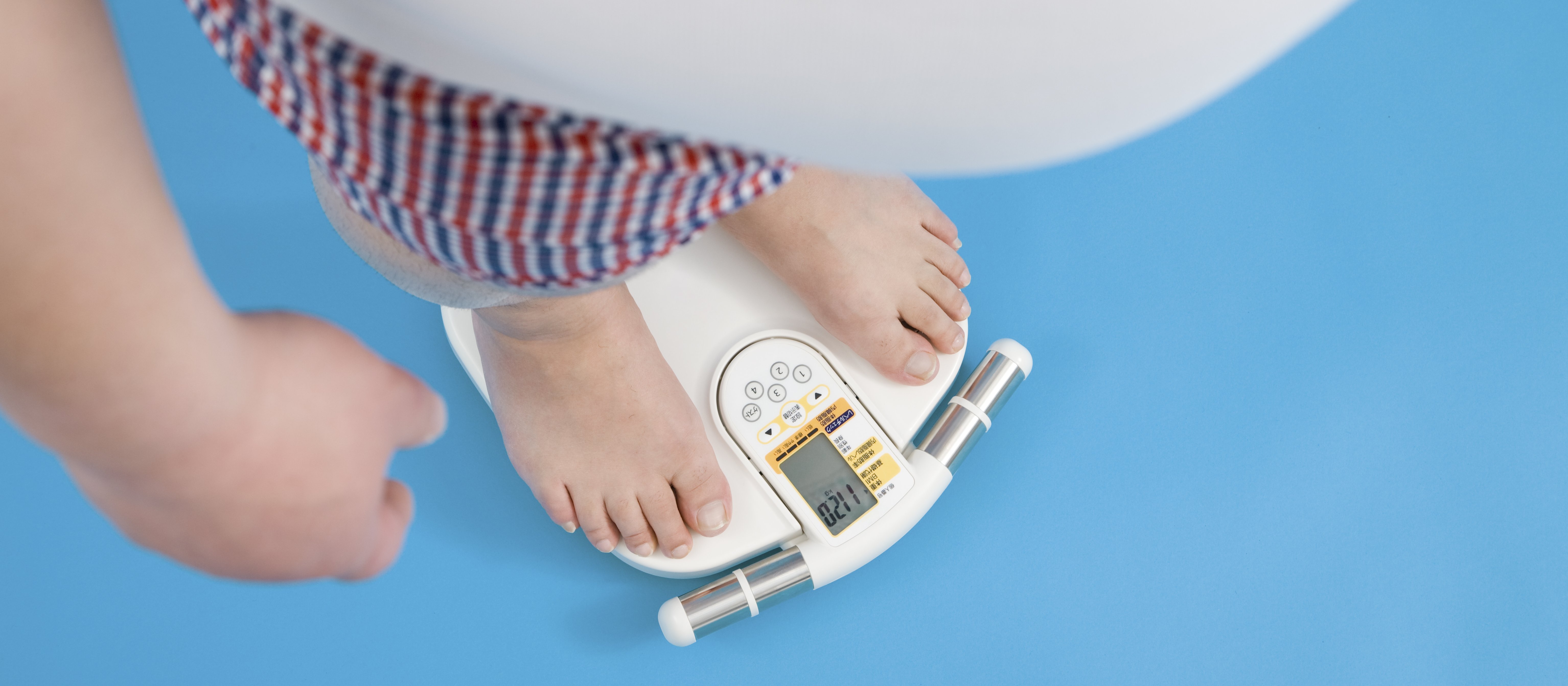 Overweight man on scales