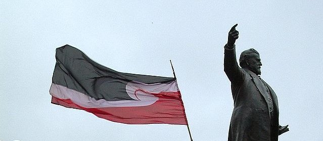 The Tino Rangatiratanga flag flying during a protest at Parliament