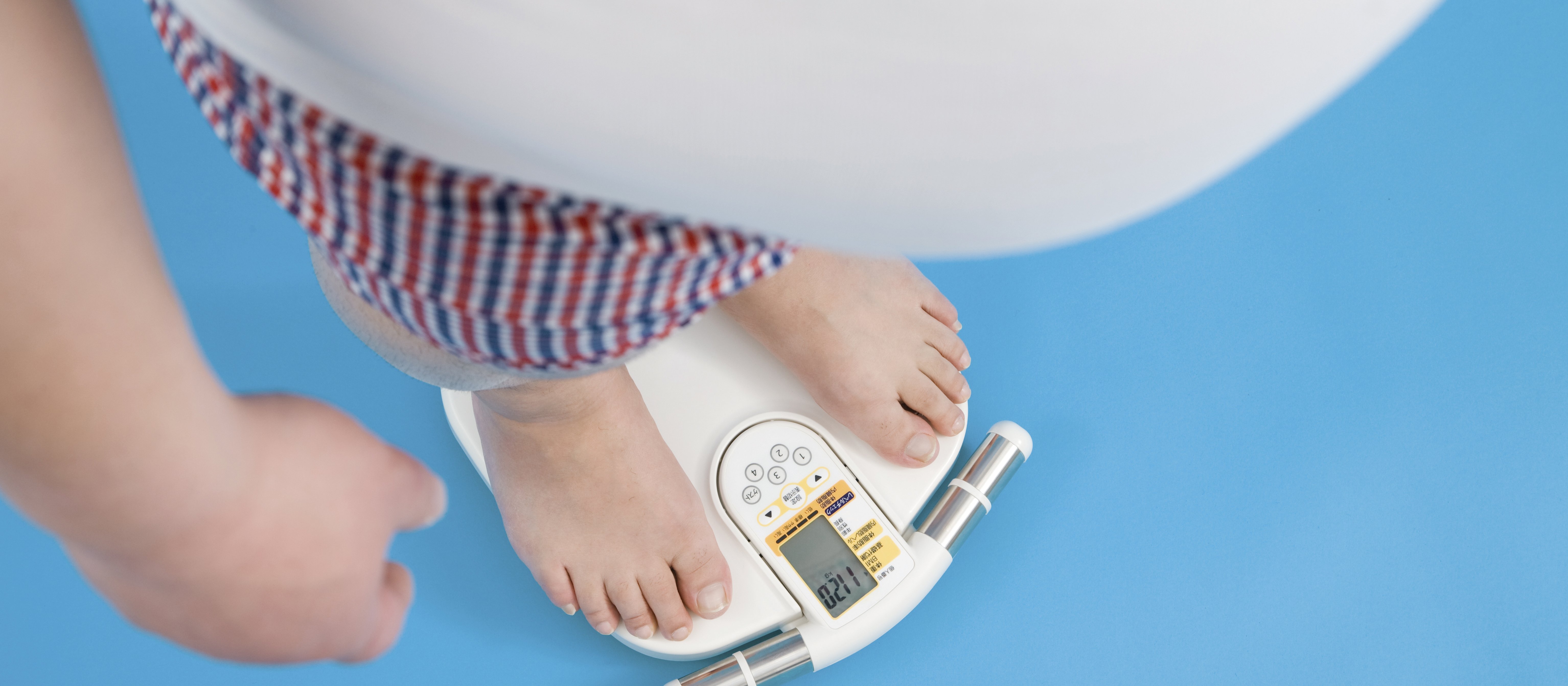 Overweight man on scales 