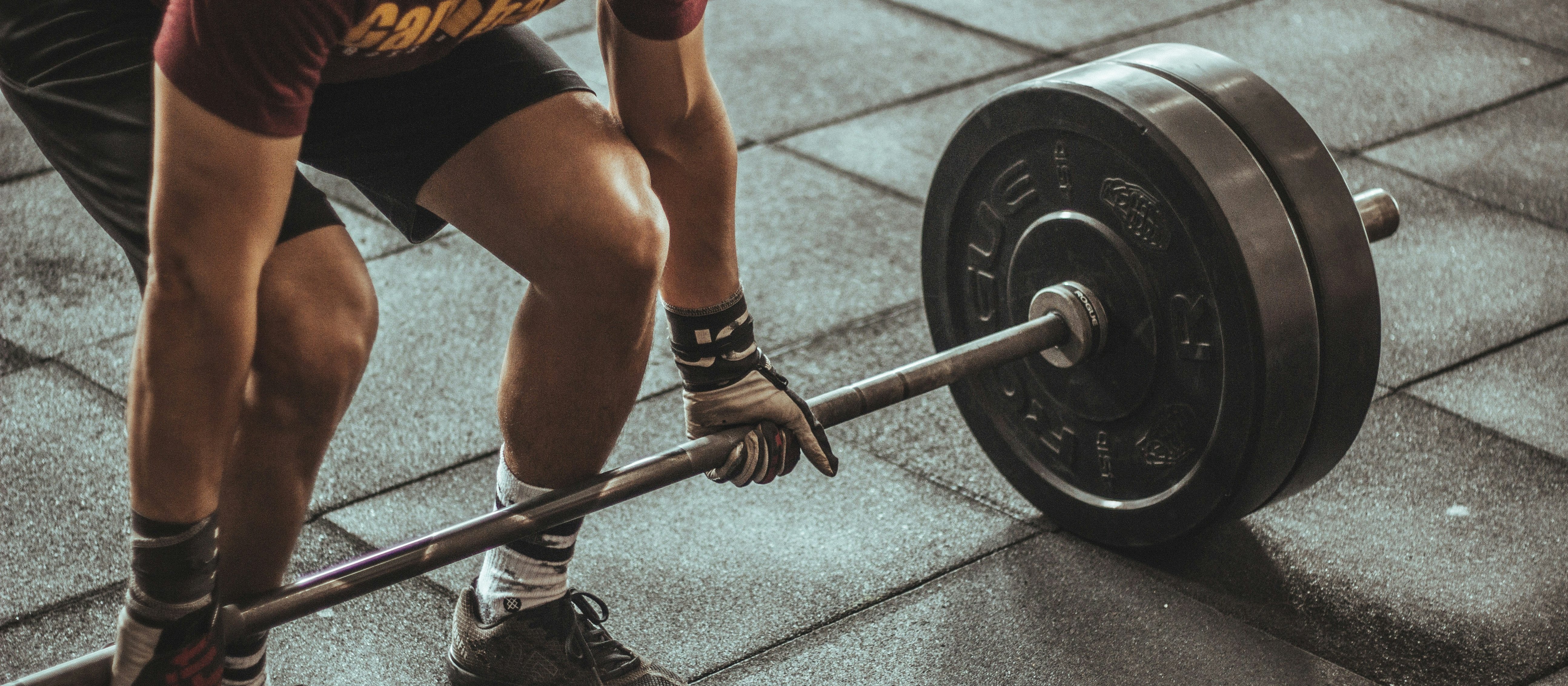 Weights, lifting, man CR Victor Freitas on Unsplash