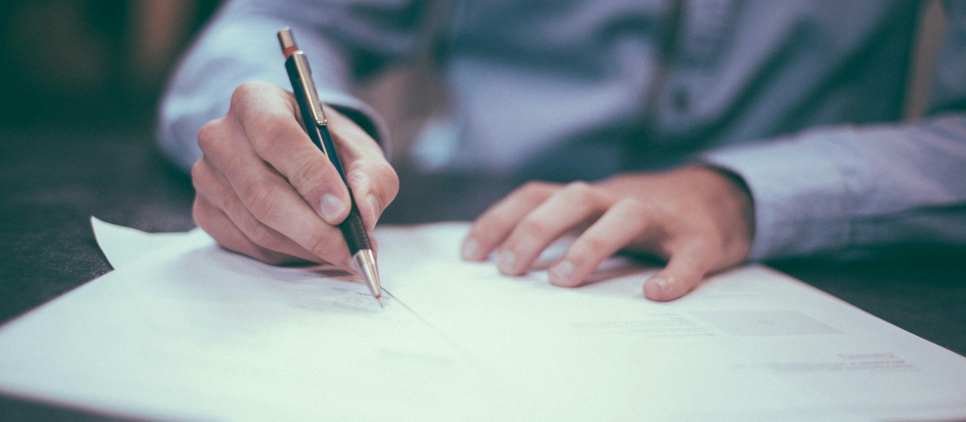 Hands writing pen CR Scott Graham on Unsplash