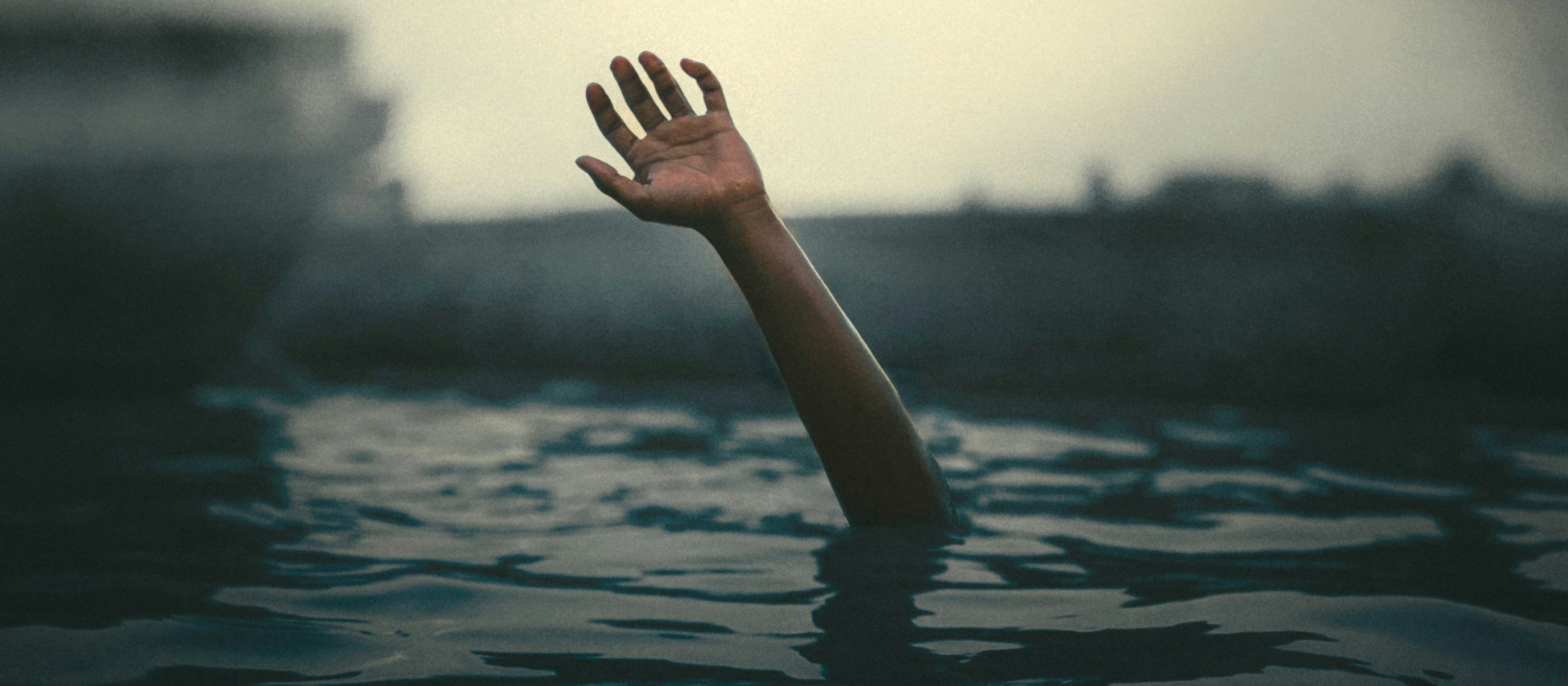 Drowning hand CR Karan Picture on Unsplash