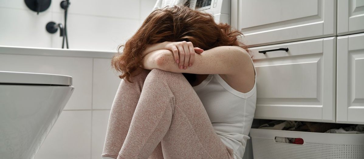Woman on bathroom floor CR Gpointstudio on iStock