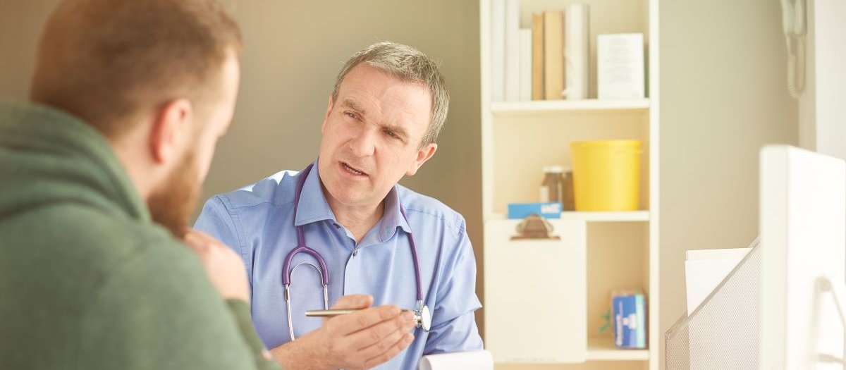 Man consulting with doctor