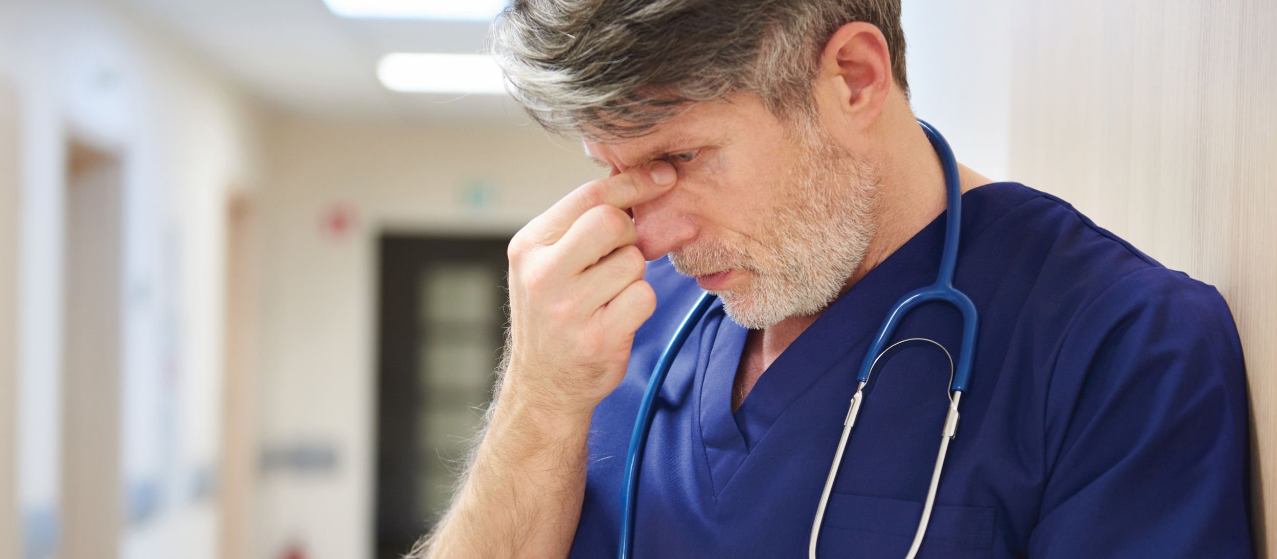 Tired doctor CR gpointstudio on iStock