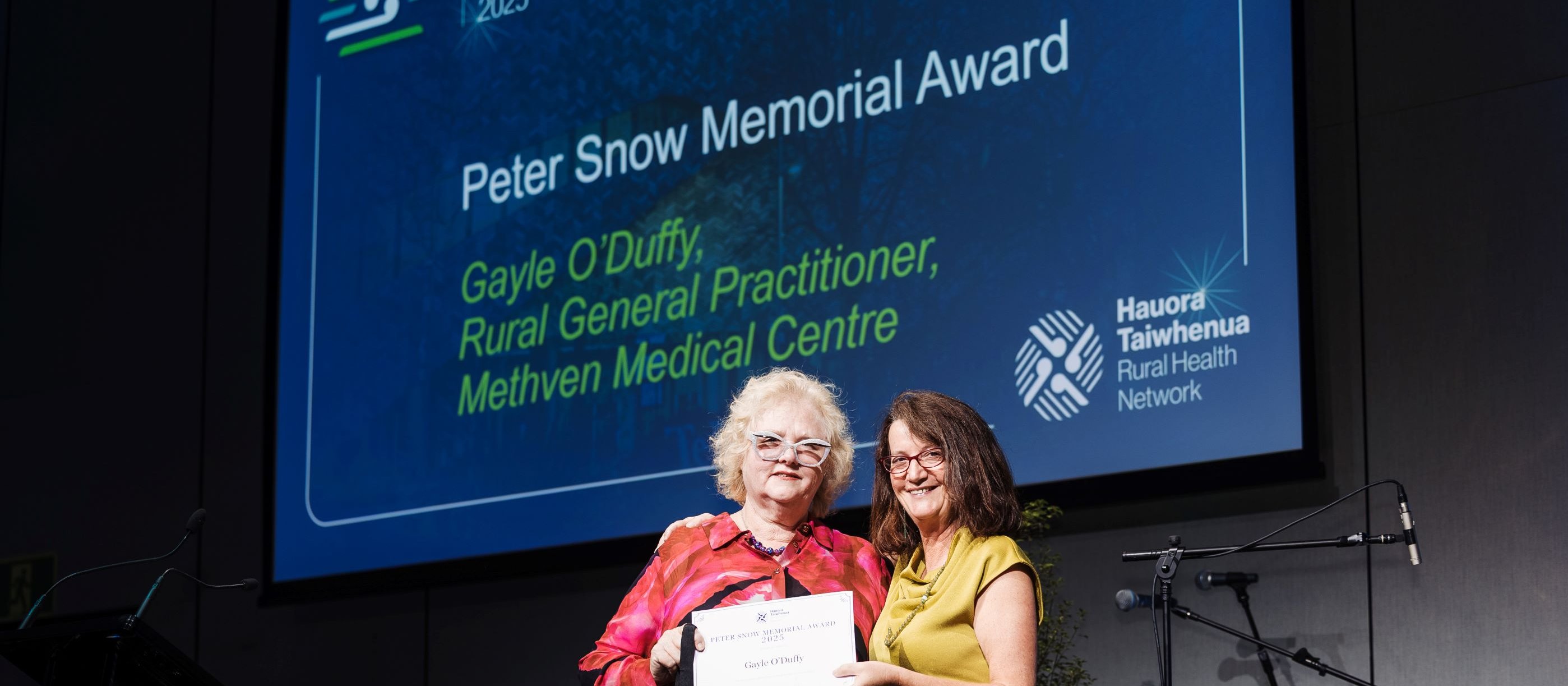 Gayle O'Duffy and Fiona Bolden presenting the Peter Snow Award 2025