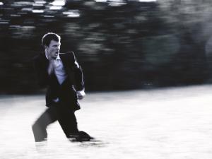 business man running, fear, escape