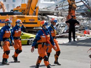 A Japanese urban search and rescue team at the ruins of the CTV building, Christchurch, 24 February 2011 [photo: Flickr/Gabriel]