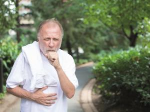 man coughing