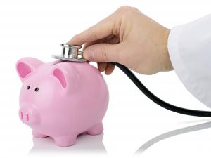 Piggy bank and stethoscope