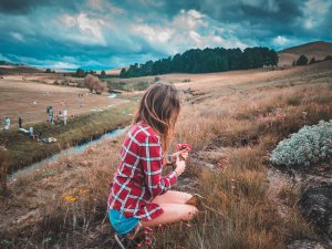 girl with flowers CR peter fogden on unsplash.jpeg